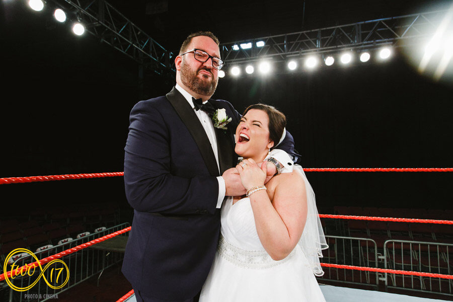 portrait of bride and groom in a wrestling ring at the 2300 Arena in Philadelphia 