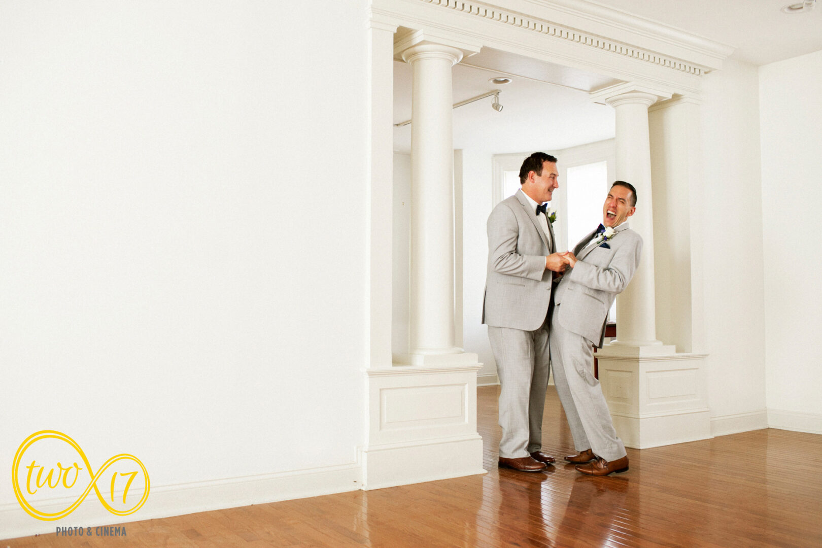 Pennsylvania grooms getting ready together before their summer wedding. 