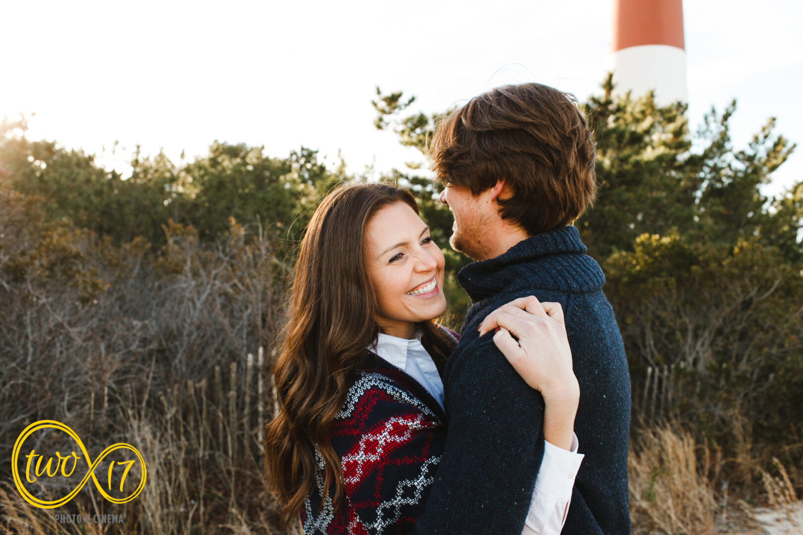Golden hour engagement photo session at Barnegat Lighthouse on Long Beach Island. 