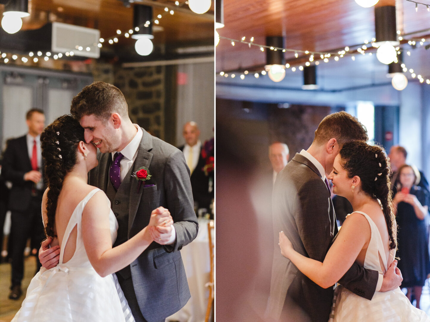 At a beautiful Rockwood Park Carriage House wedding, a couple dances closely at the reception, surrounded by guests and illuminated by string lights. The groom in his suit with a red rose and the bride in her white dress create an enchanting scene that captivates all.