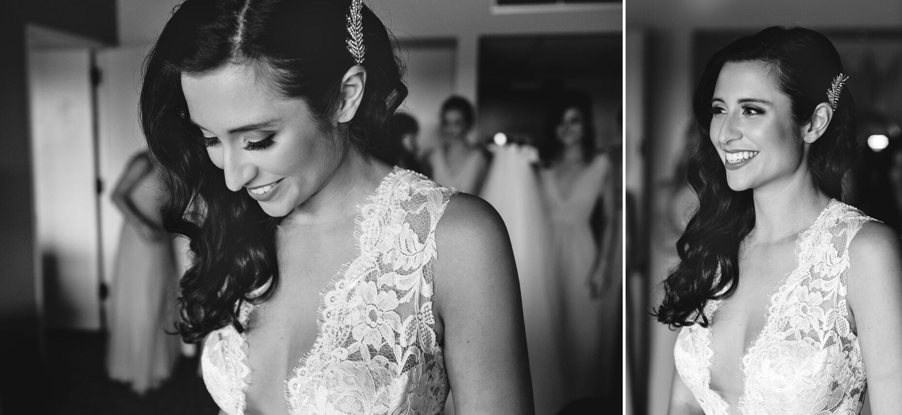 A bride in a lace dress smiling, with bridesmaids softly blurred in the background, beautifully captured in black and white at a Chubb Conference Center wedding.