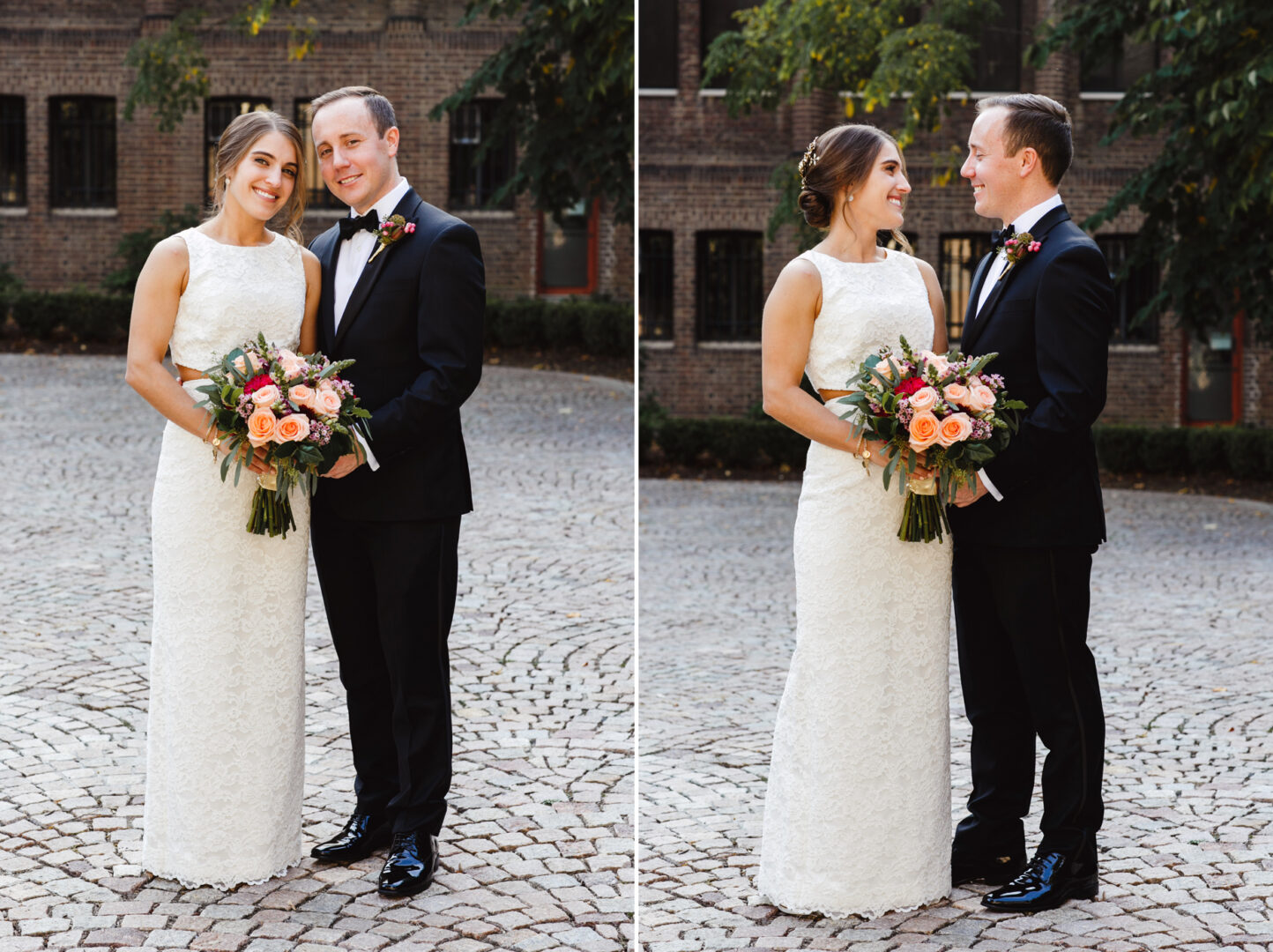 A smiling couple stands together on cobblestones, dressed in formal attire for their Penn Museum wedding. The woman holds a bouquet of orange and pink flowers as they pose in front of a brick building adorned with greenery.