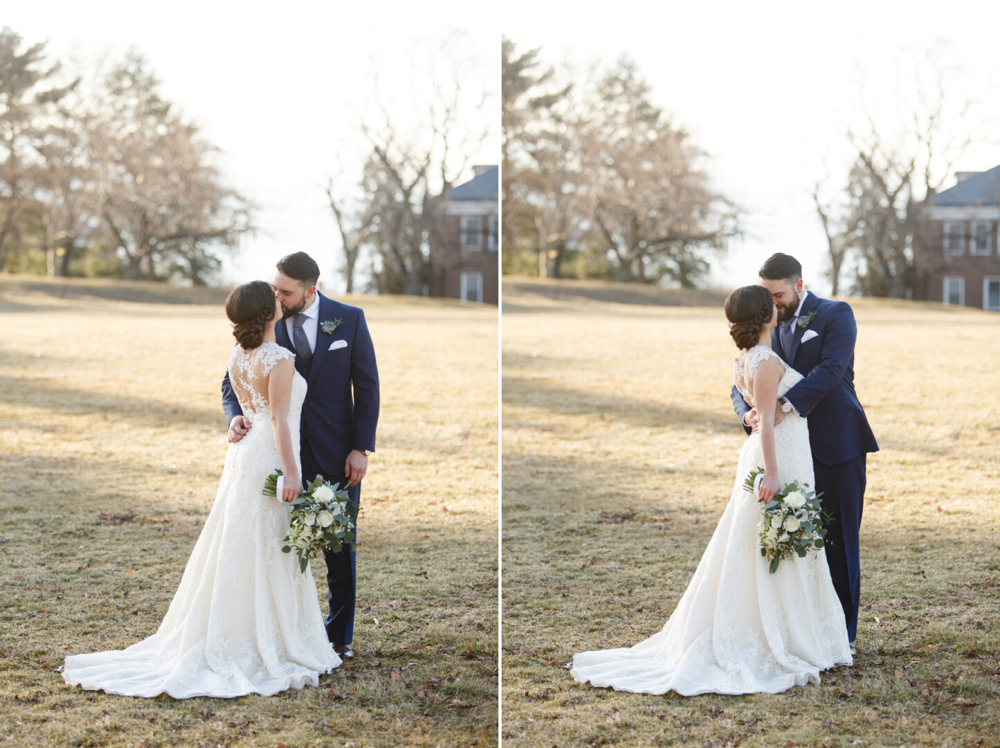 At a picturesque Palace at Somerset Park wedding, a bride in a white dress and a groom in a blue suit stand closely together outside, holding a bouquet, with trees and an elegant house providing the perfect backdrop.