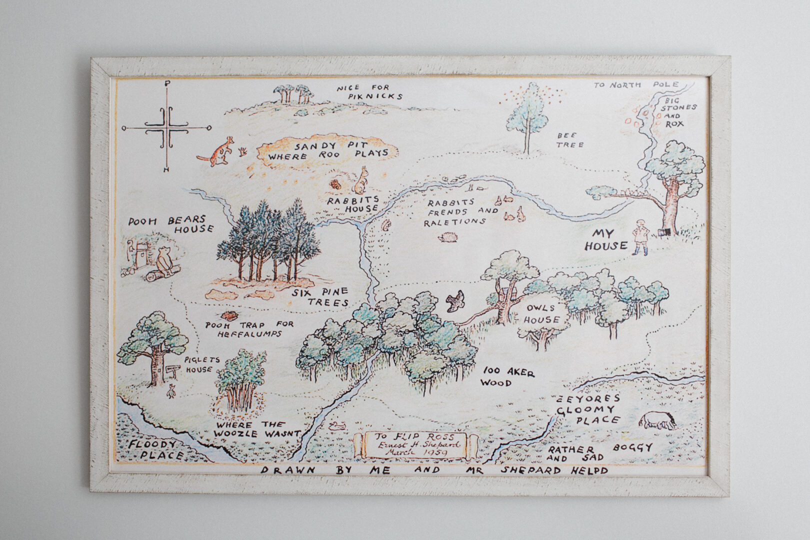 An illustrated map of the Hundred Acre Wood, perfect for cherishing newborn photos, features landmarks like Pooh Bear's House, Rabbit's House, and Piglet's House. It includes trees, rivers, and clearly labeled paths to guide your adventures.