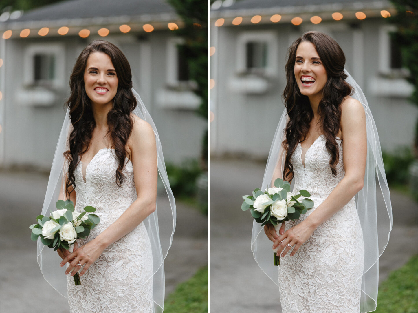 A bride in a white lace dress and veil, celebrating her High Point wedding, holds a bouquet of white roses, smiling outdoors near a blurred building with lights.
