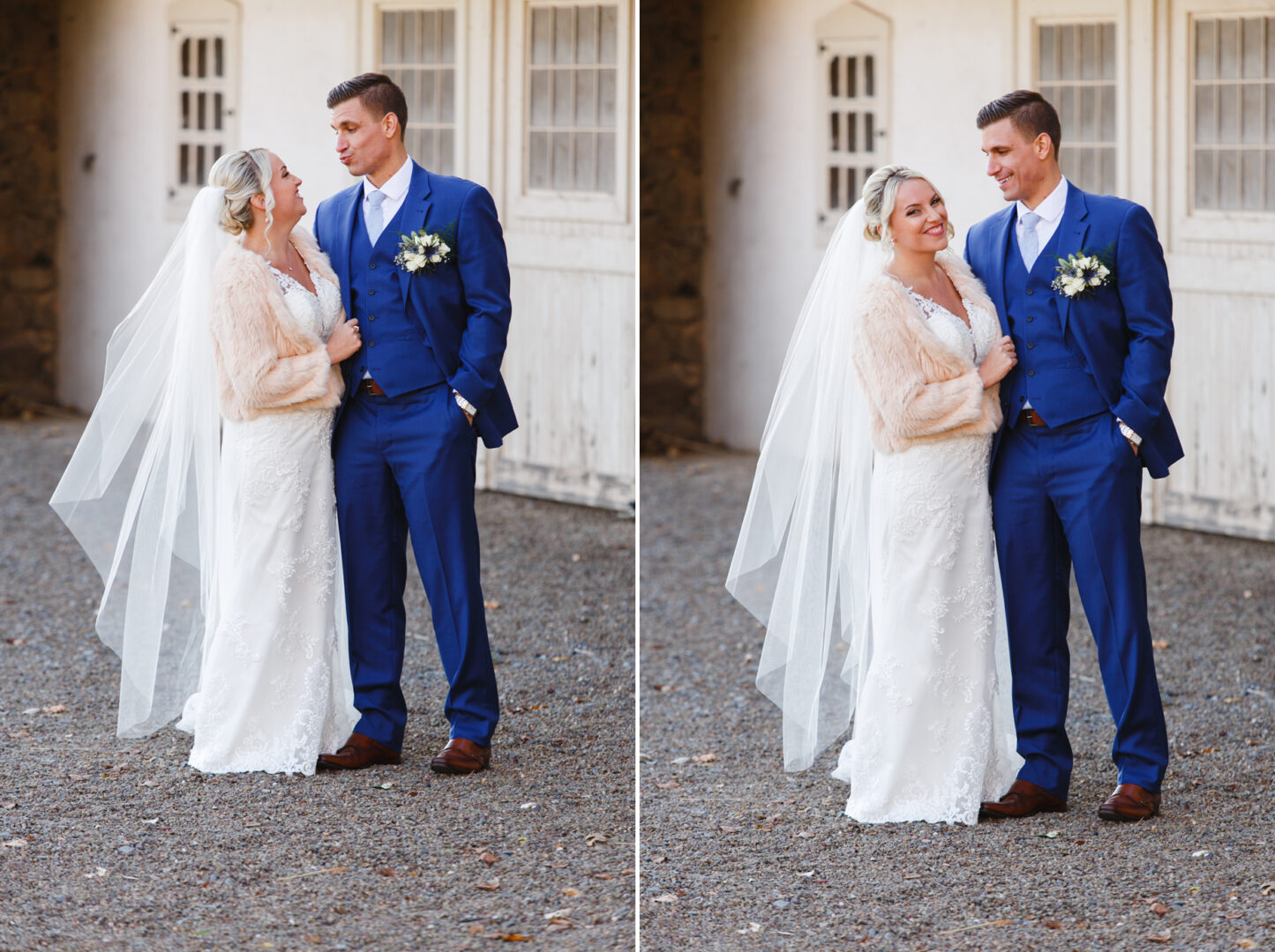 A couple in wedding attire stands outdoors at the charming French Creek Golf Club Wedding. The bride wears a white dress and veil, while the groom dons a blue suit. They smile warmly at each other, framed by the rustic building behind them.