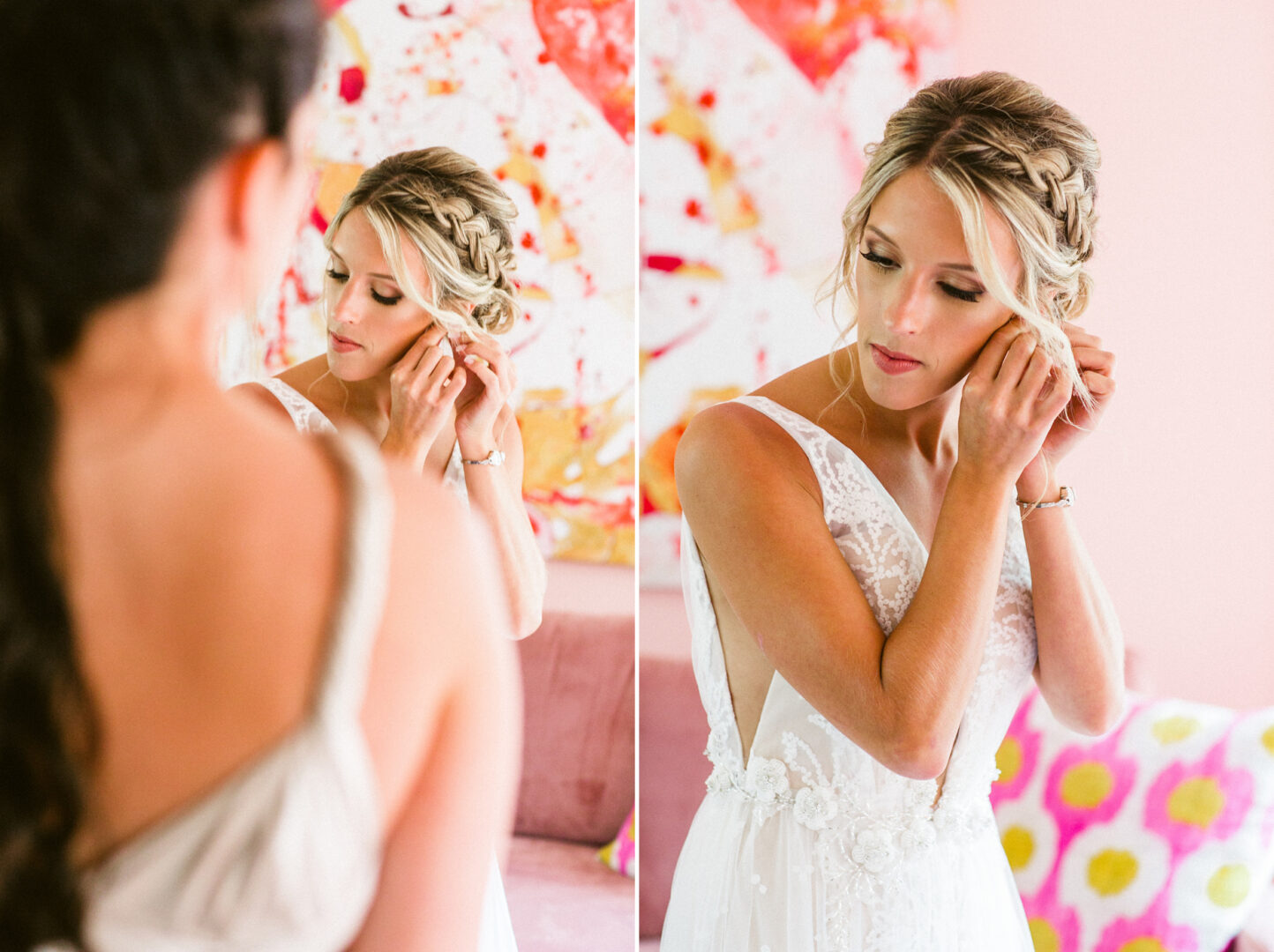 In a floral-patterned room at Willow Creek Winery, a bride adjusts her earring, her braided hair complementing the elegance of her white lace wedding dress.