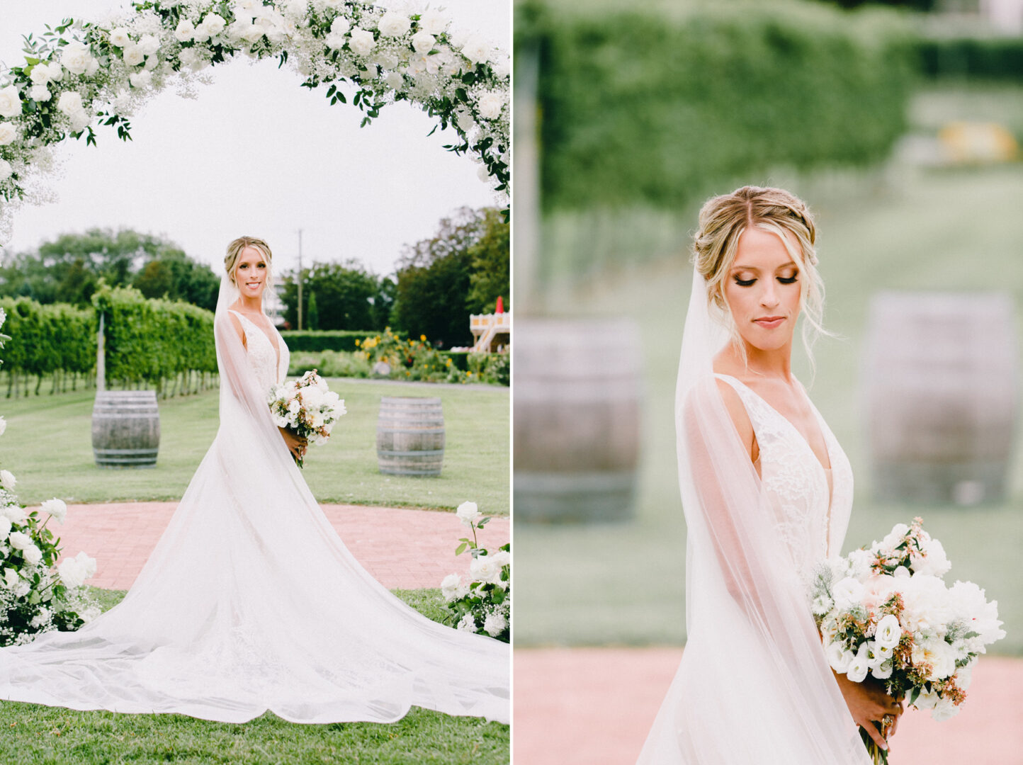The bride, in a white gown, stands outdoors under a floral arch at Willow Creek Winery Wedding, holding a bouquet. A green vineyard and blurred wine barrels provide the perfect backdrop for this enchanting moment.