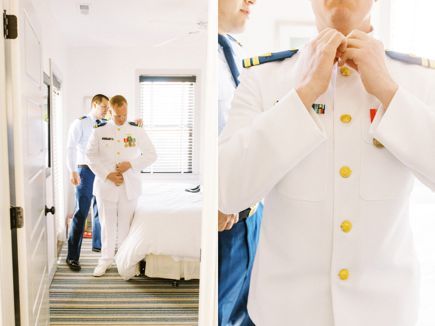 Two people in white military uniforms adjust their attire in a bright room, reminiscent of a wedding by the beach in Cape May. One person helps another with their collar, while a striped carpet and bed add charm to the scene.