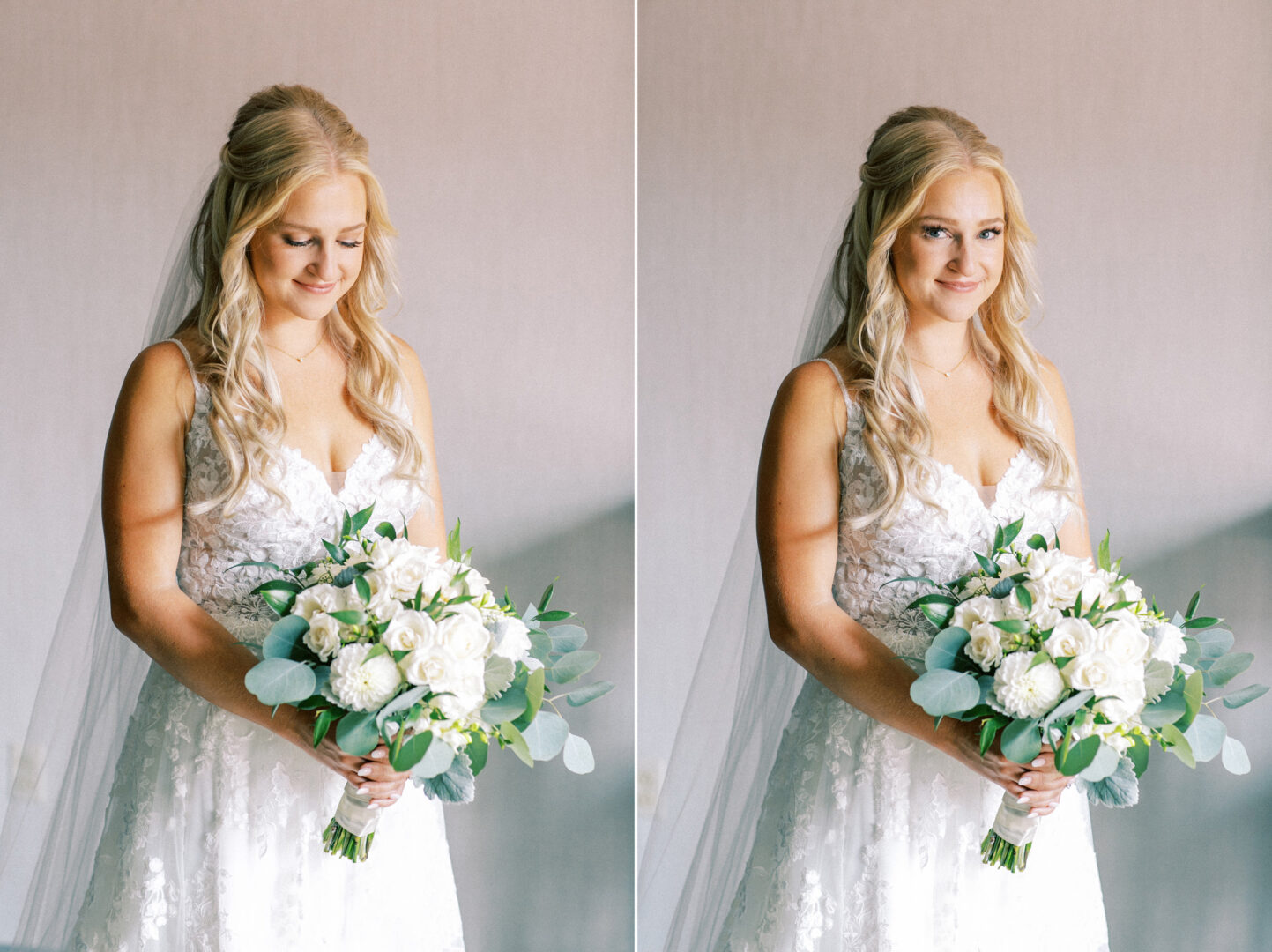 A bride in a white lace dress, embodying the rustic charm of a Normandy Farm Wedding, holds a bouquet of white flowers and greenery. She stands indoors with a slight smile, her hair styled in loose waves.