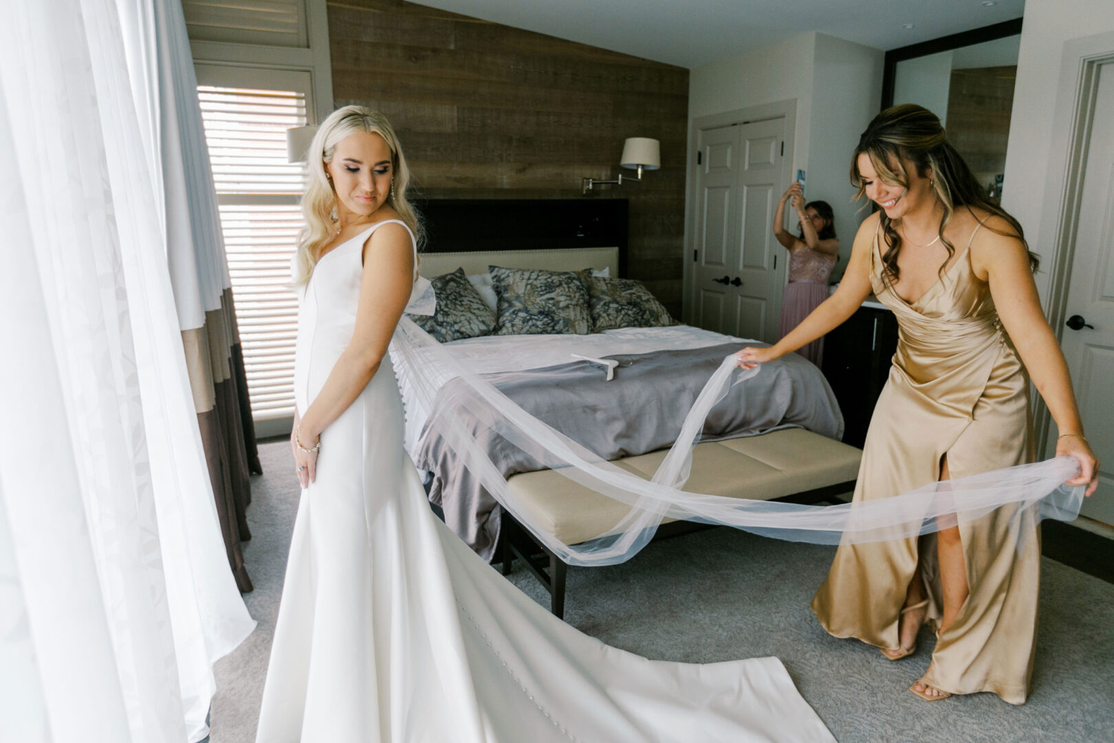 Caitlin helped into her dress for her new hope wedding.