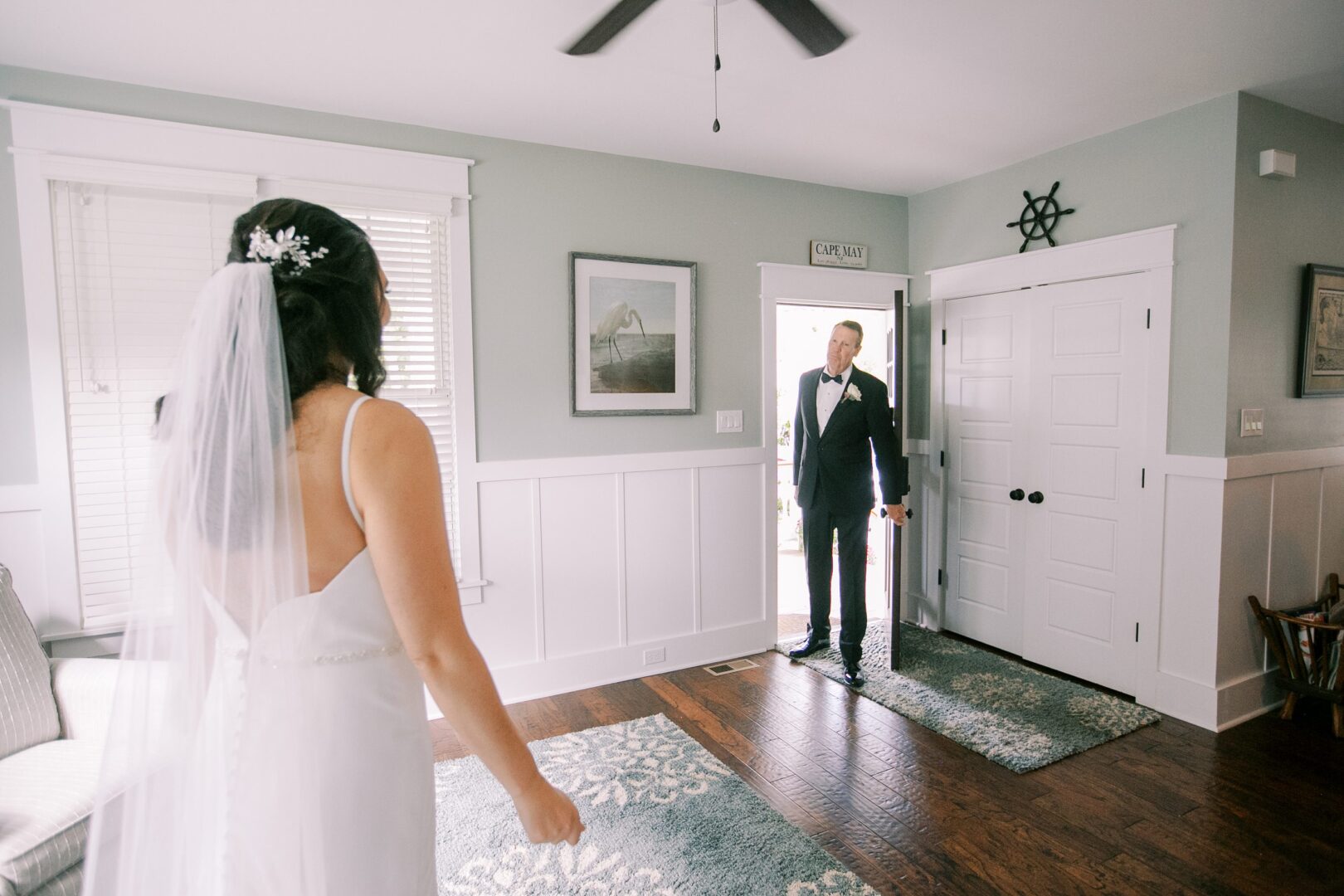 A father and bride see each other for the first time on a Cape May wedding day.