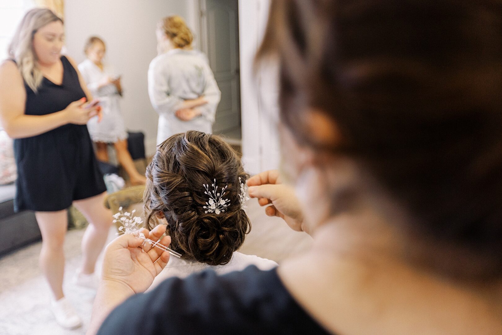 A bride gets her hair done on her wedding day at Renault Winery in New Jersey.