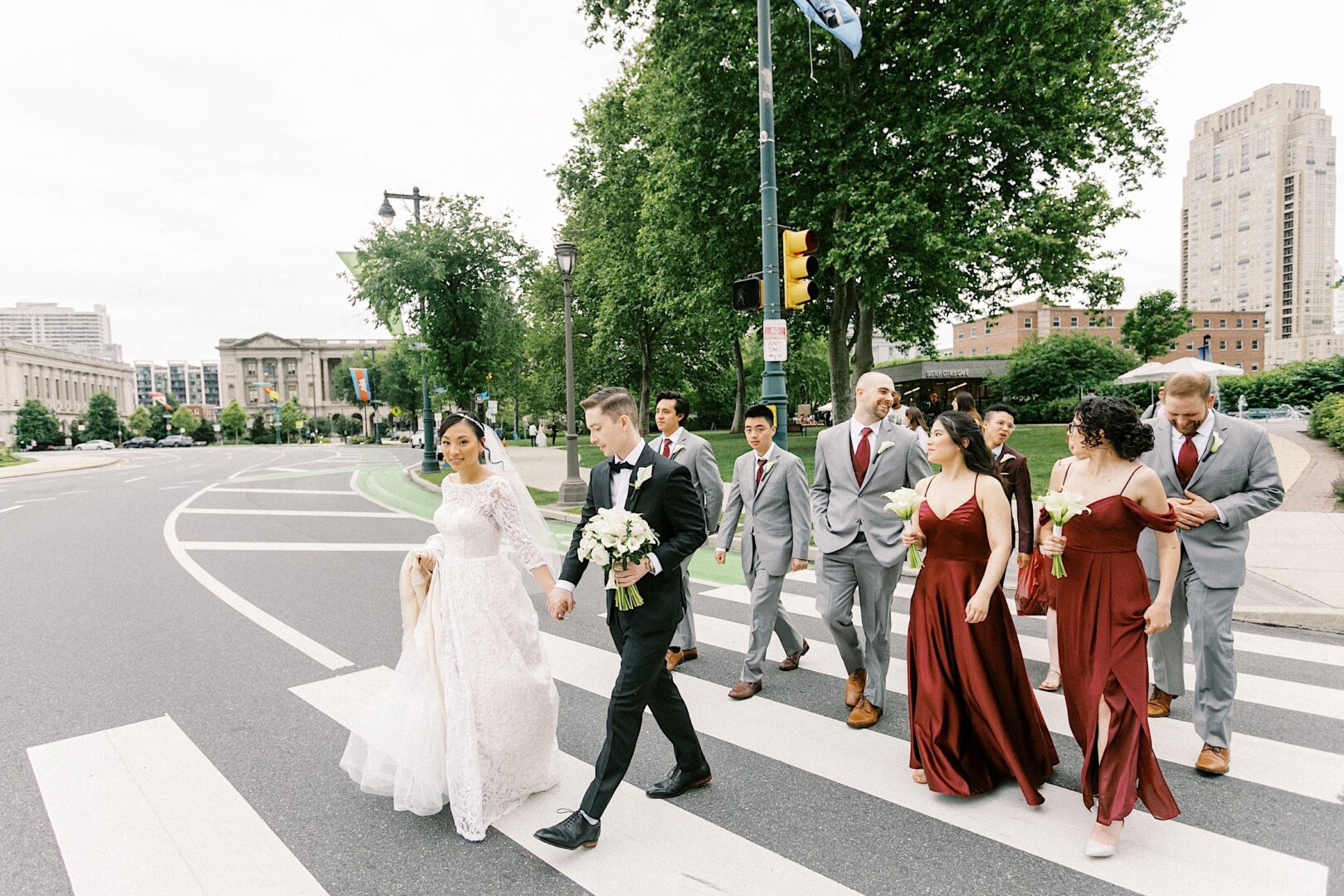 Bridal party crossing the street from a metropolitan Philadelphia wedding