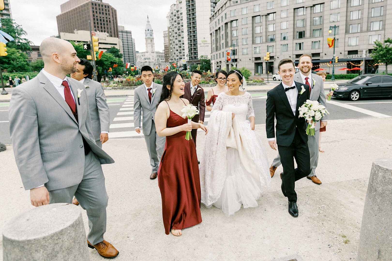 Bridal party walking the streets of Philadelphia from a modern city wedding by Two17 Photo & Cinema