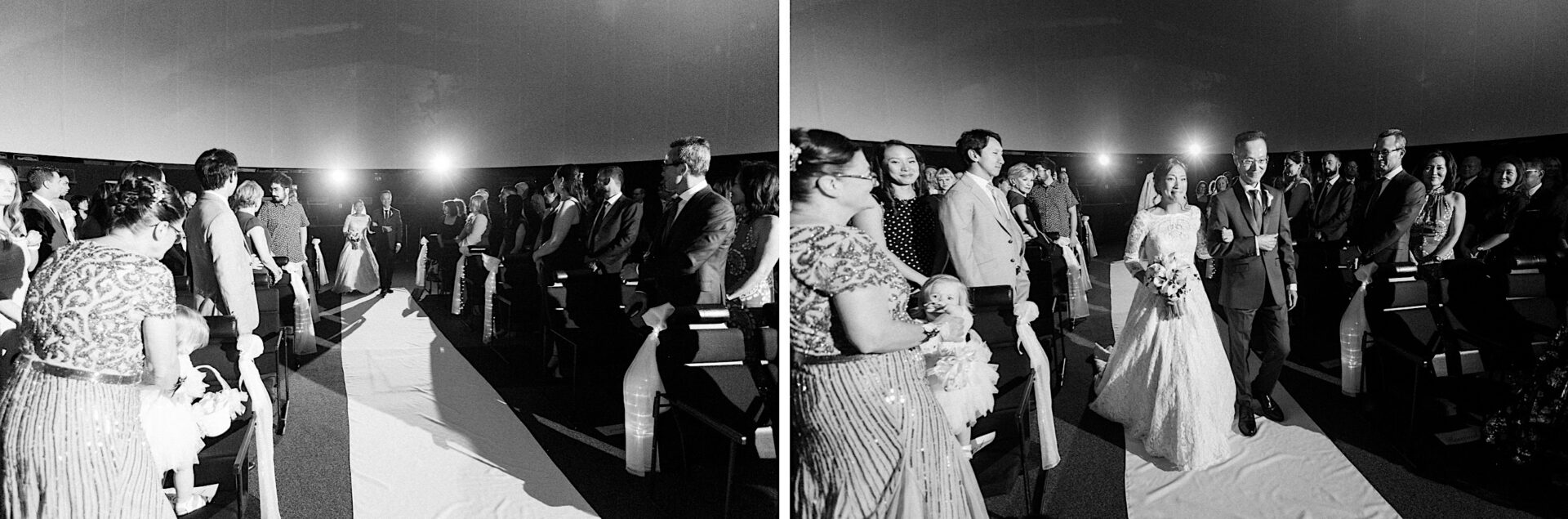 Bride walking into her wedding ceremony in a planetarium at the Franklin Institute in Philadelphia