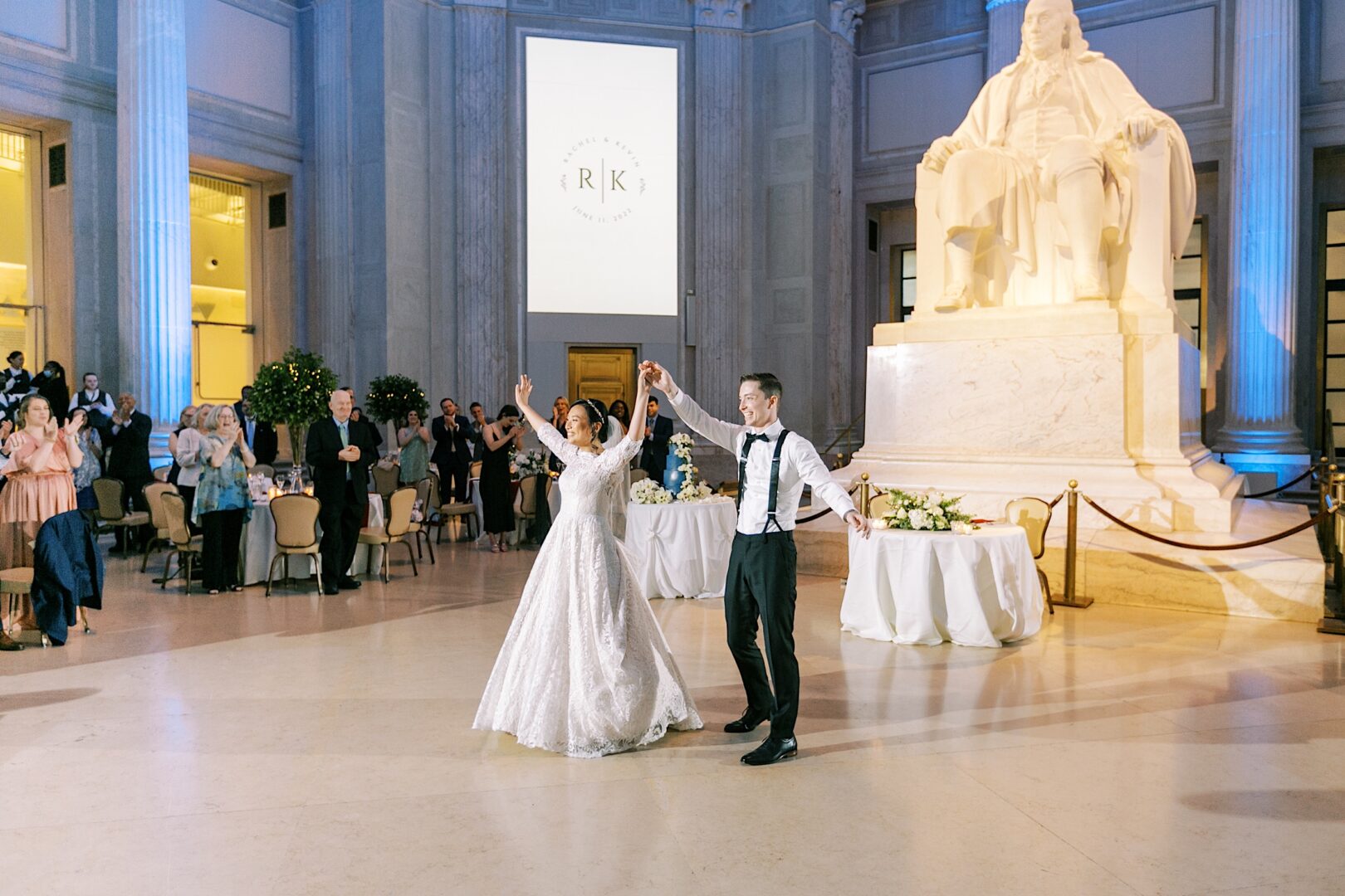 Bride and Groom riling the crowd at their modern urban wedding in Philly