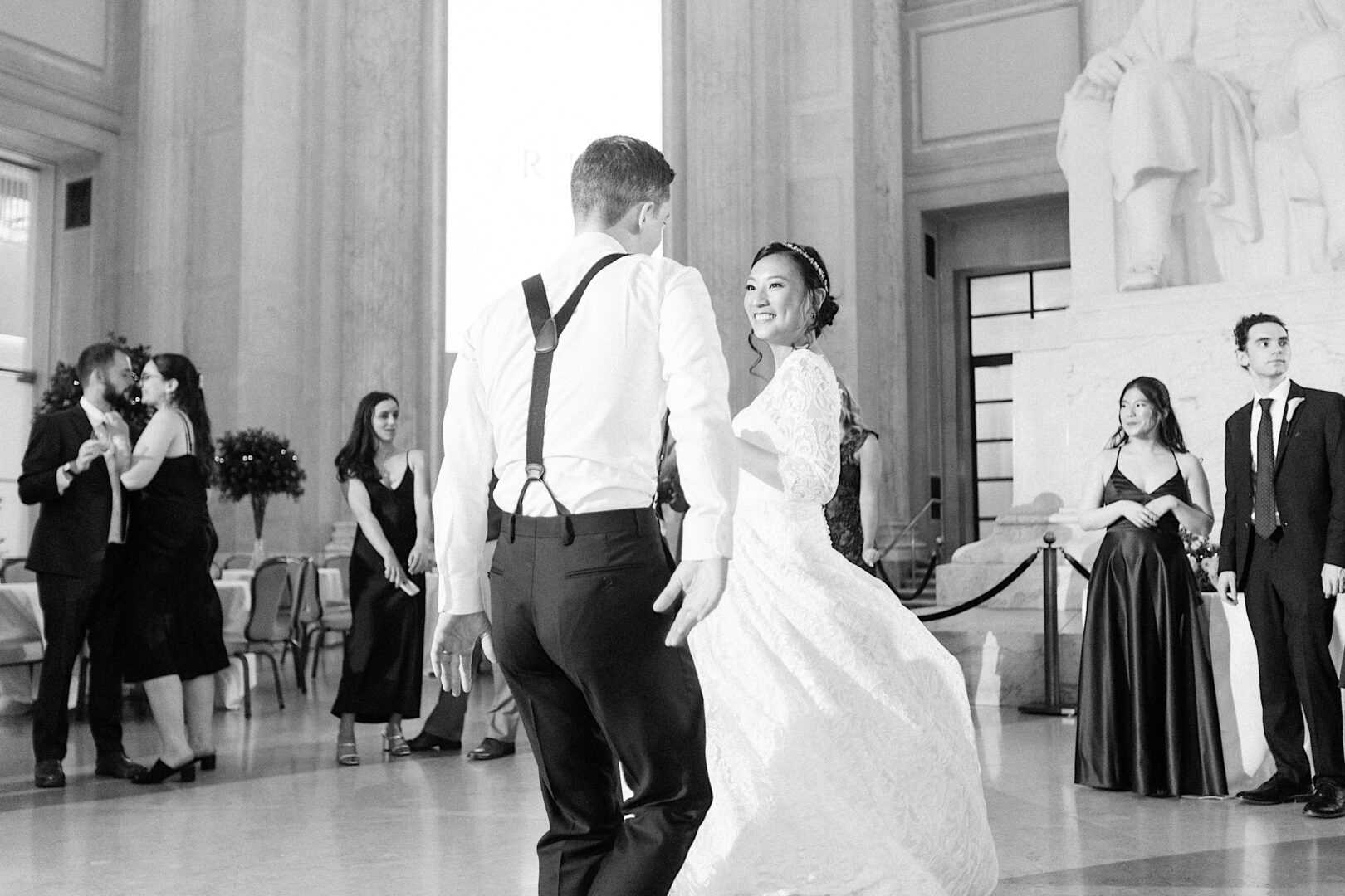 Bride and Groom dancing together at their city wedding at the Franklin Institute