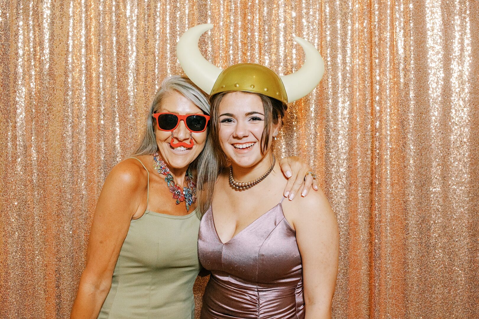 Guests posing in a photo booth at a Philly wedding by Two17 Photo & Cinema