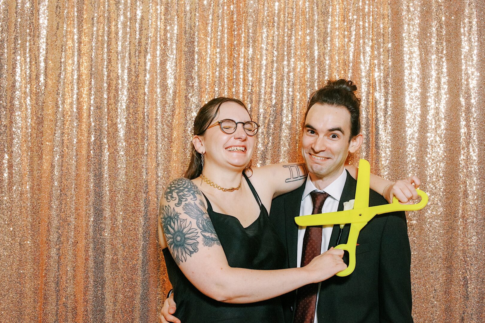 Guests posing in a photo booth at a Philadelphia wedding by Two17 Photo & Cinema