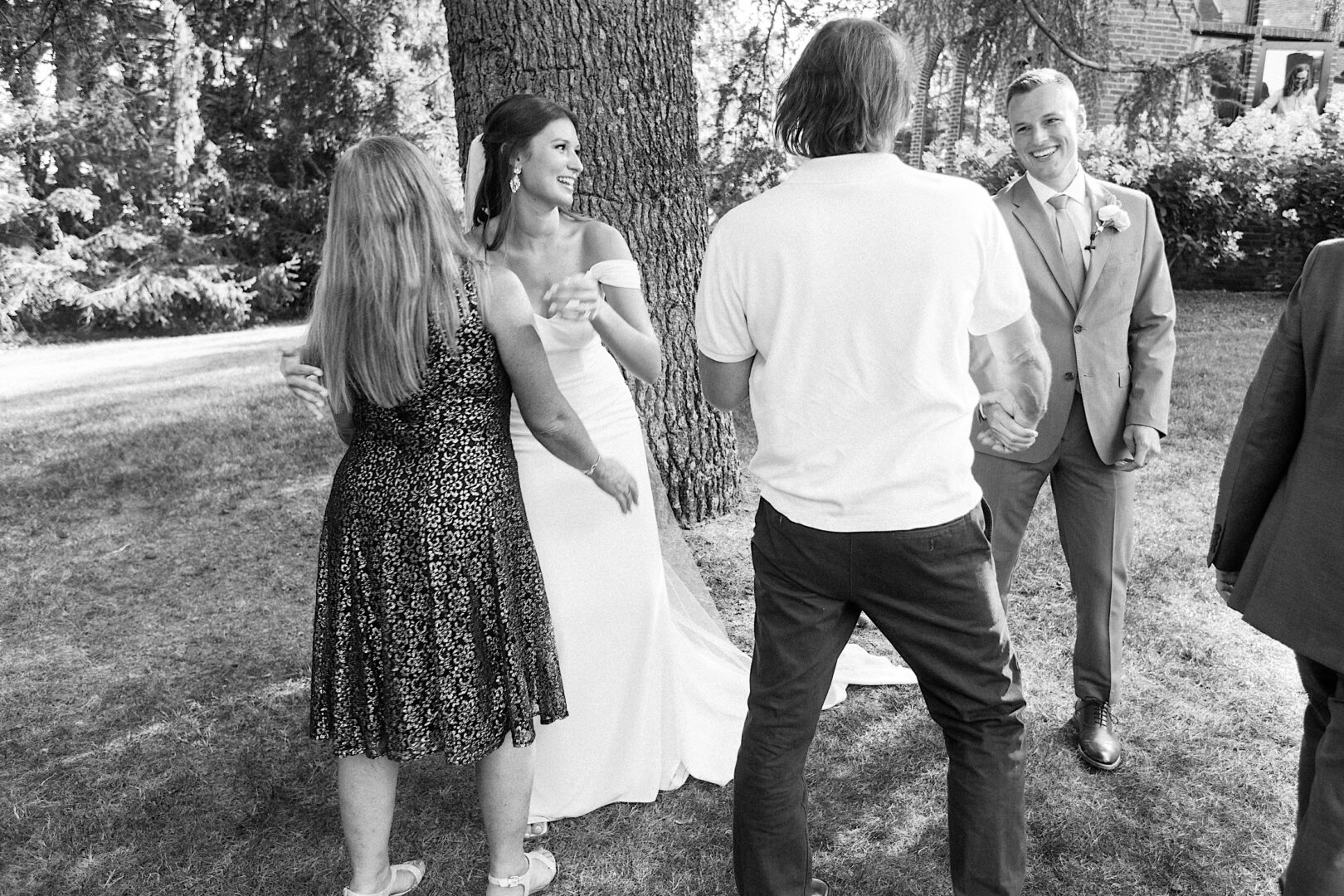 Bride hanging out with guests by Philadelphia wedding photographer Two17 Photo & Cinema