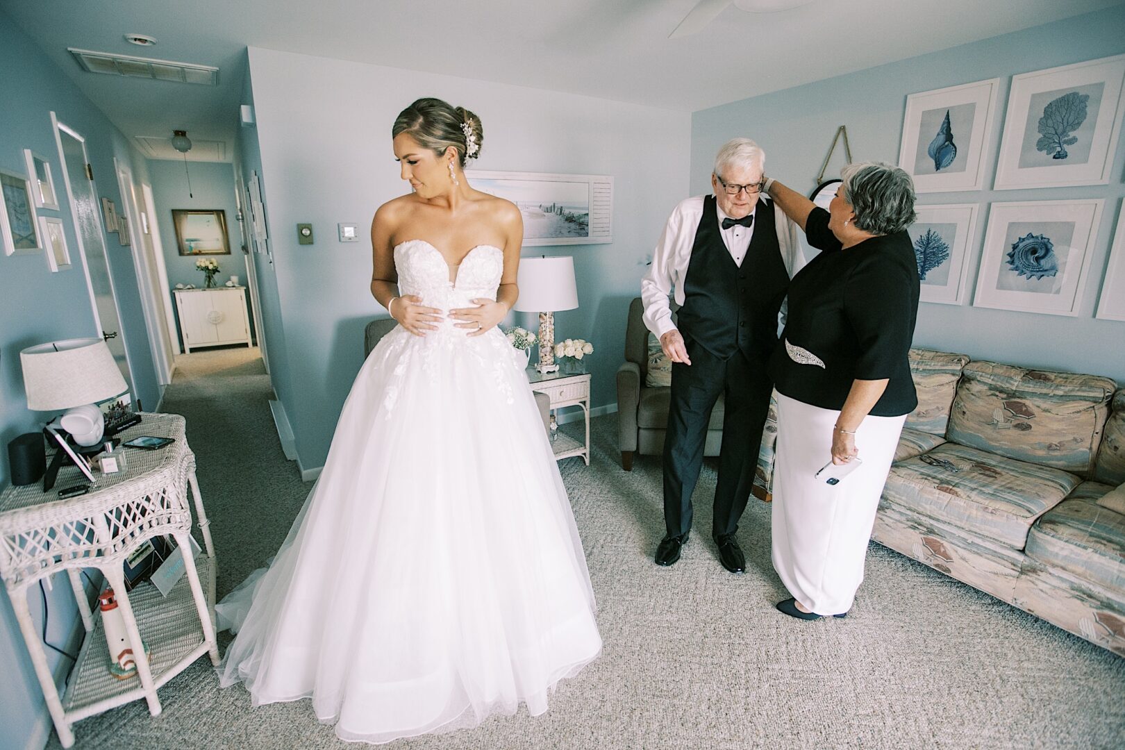 A bride gets dressed at her home in Cape May on her wedding day