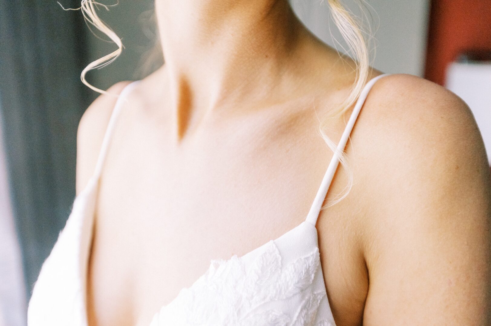 Wedding dress bodice detail and bridal curls before a modern wedding day in Philadelphia