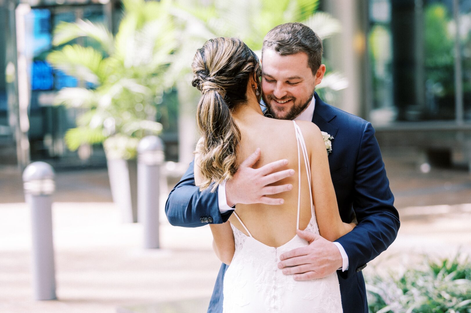 Bride and groom hug after their first look in Philadelphia's Center City