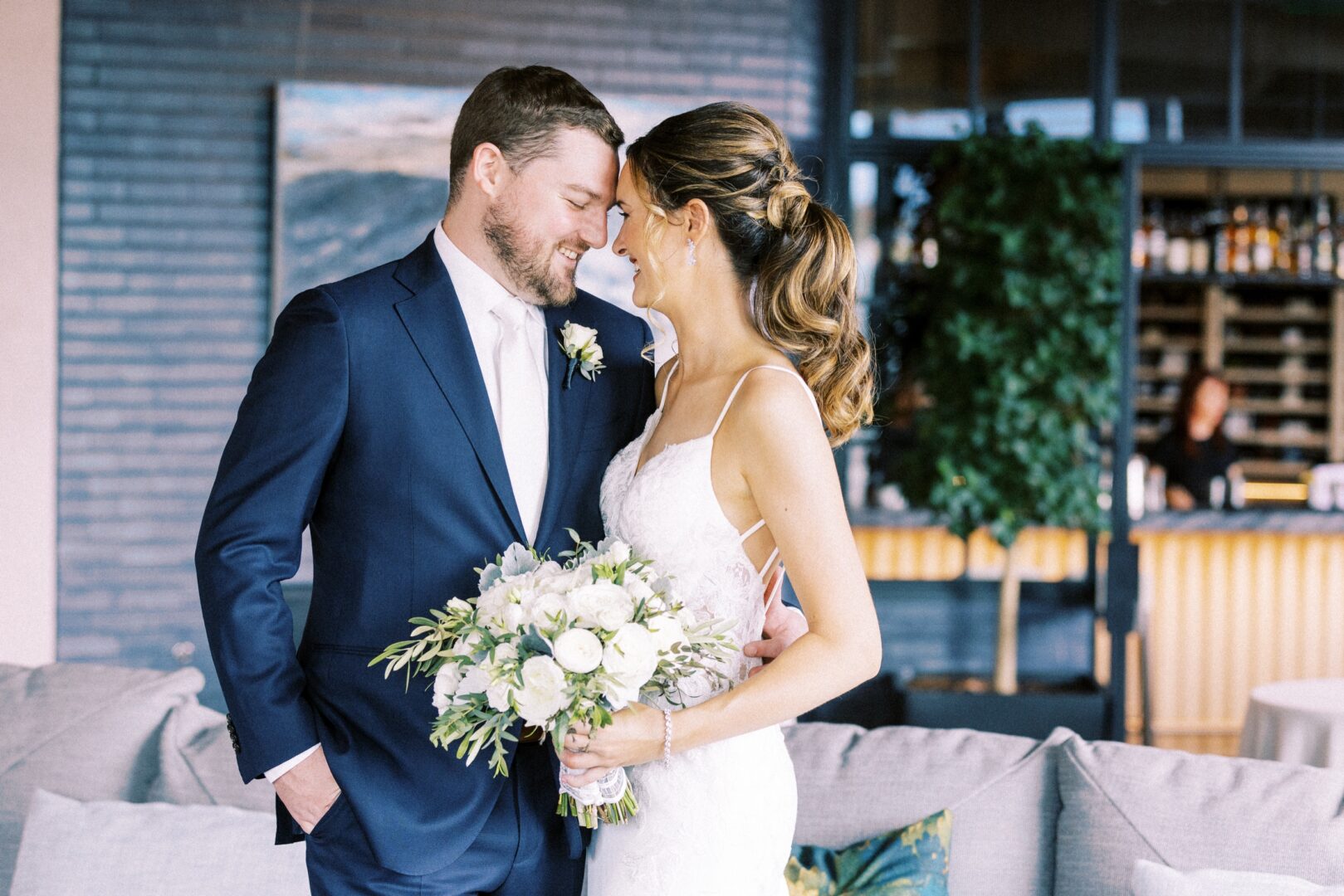 Bride and groom cuddling on a modern summer wedding day in Center City by Philadelphia photographer Two17 Photo & Cinema