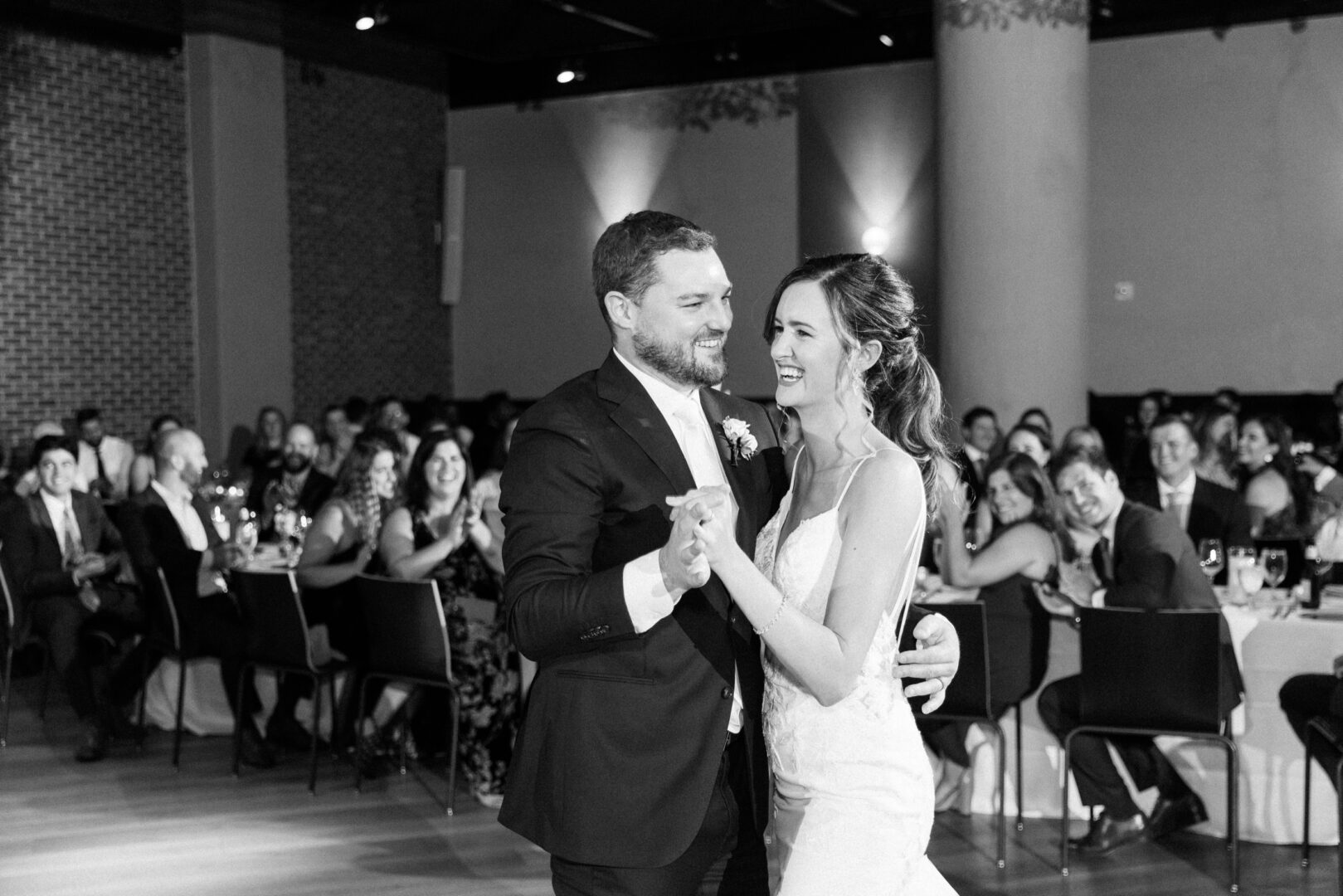 Newlyweds have their first dance at a chic Fitler Club wedding reception on a summer day in Center City