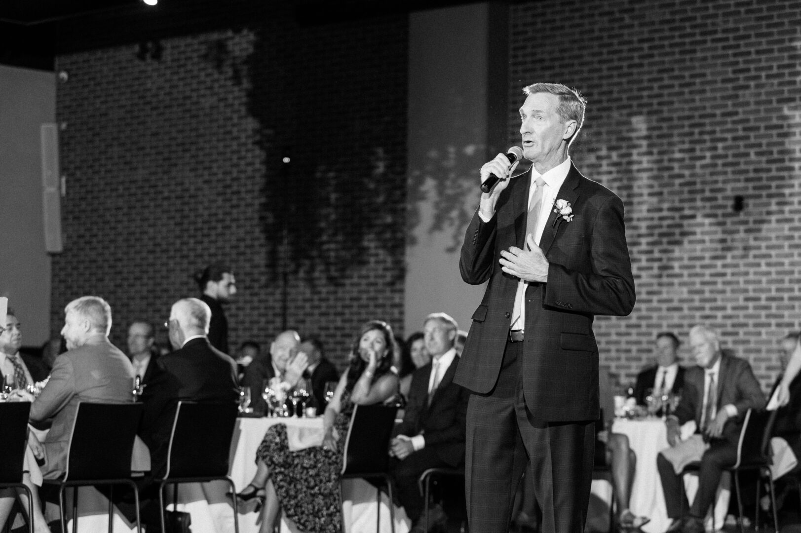 Father of the bride gives a speech at a members only club chic wedding reception in Center City