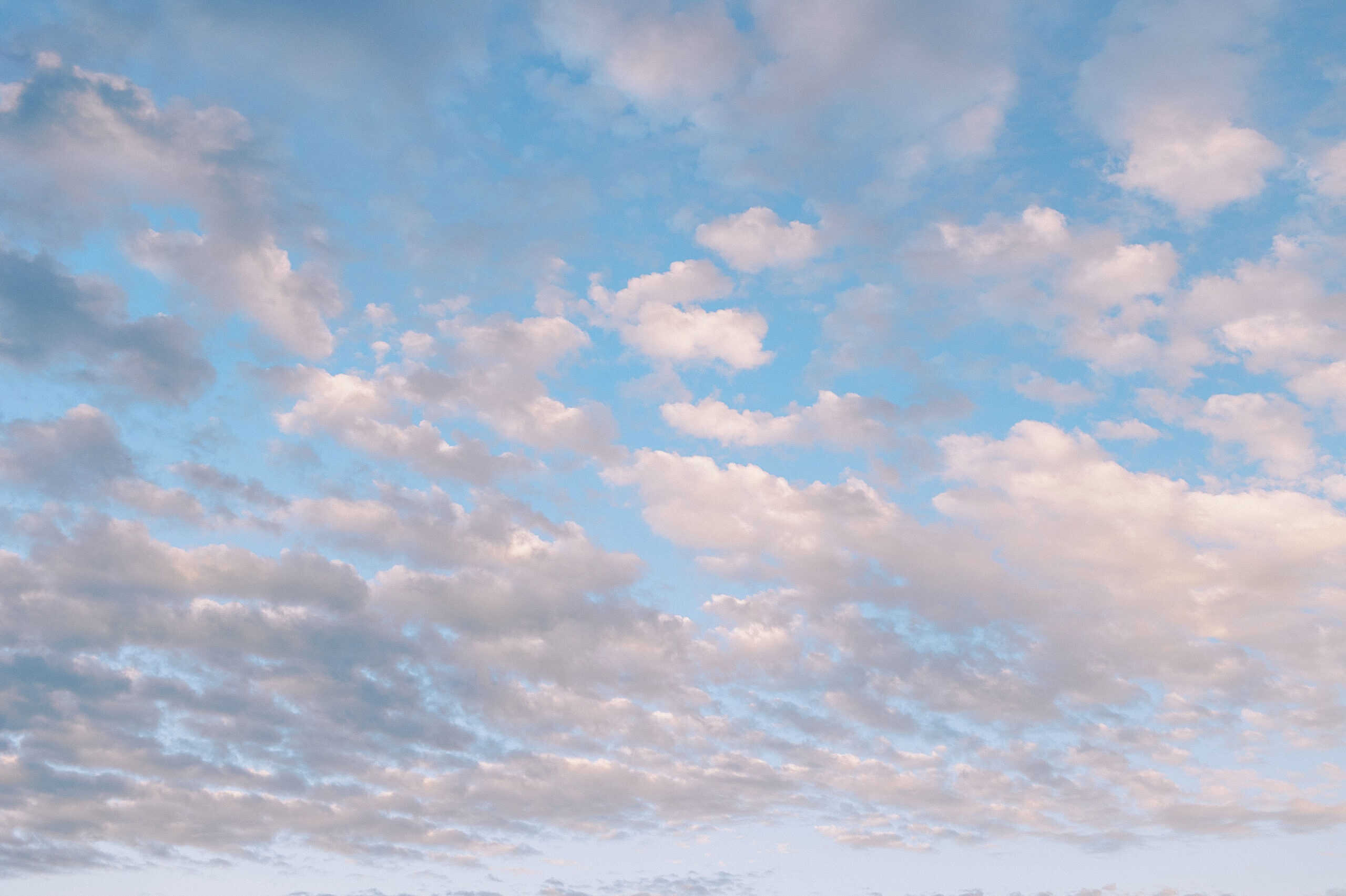 Blue sky with scattered, fluffy white and light gray clouds—perfect for a Cape May wedding at the Virginia Hotel.