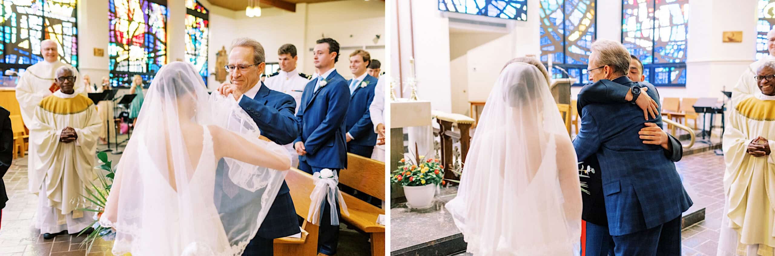 At a Summer Wedding at The High Point, a bride in a veil greets and hugs an older man in a suit at the altar, surrounded by wedding party members and clergy in a church with beautiful stained glass windows.