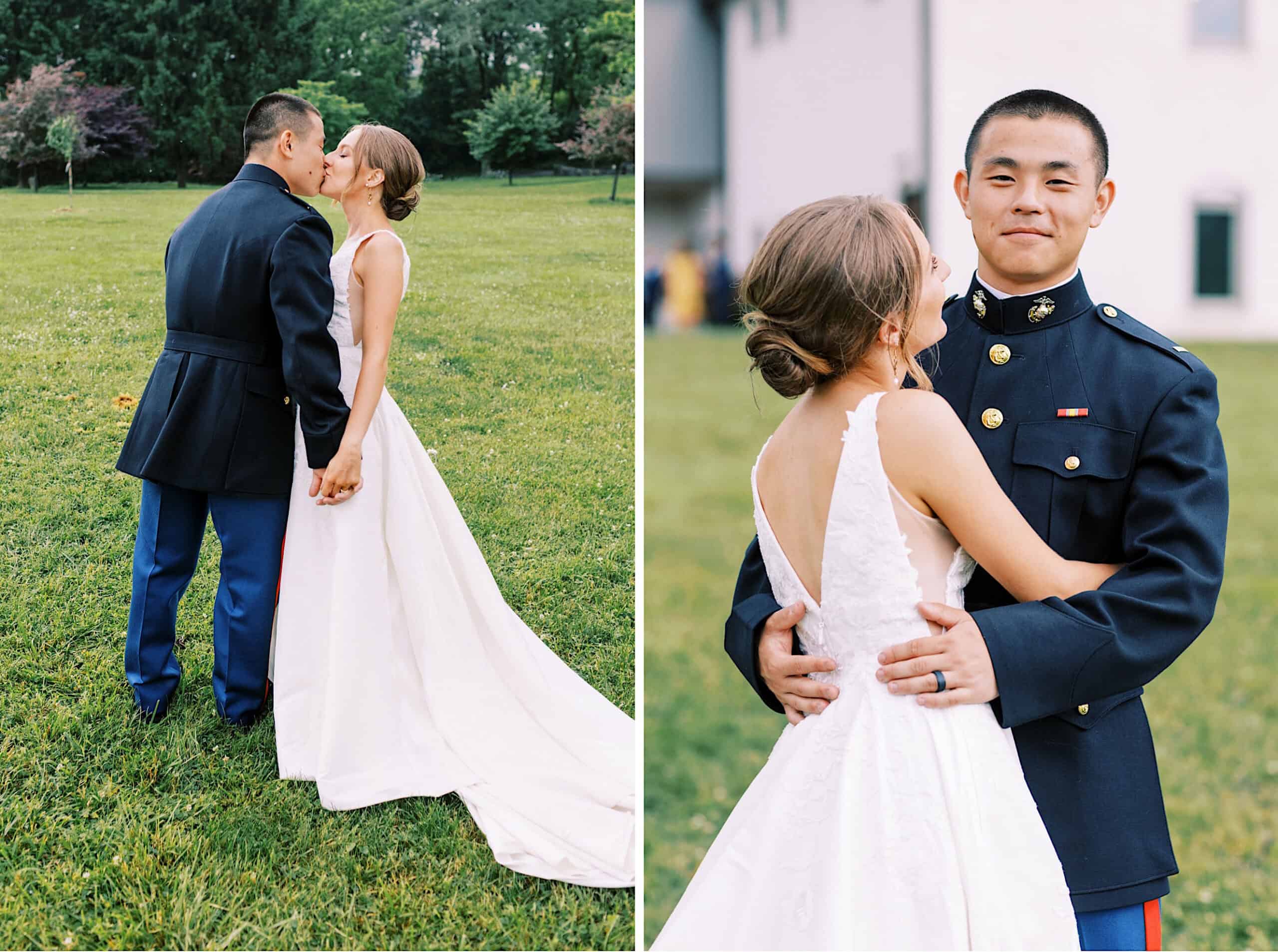 A bride in a white dress and a groom in a military uniform stand outdoors, holding hands and embracing on the grass during their summer wedding at The High Point.