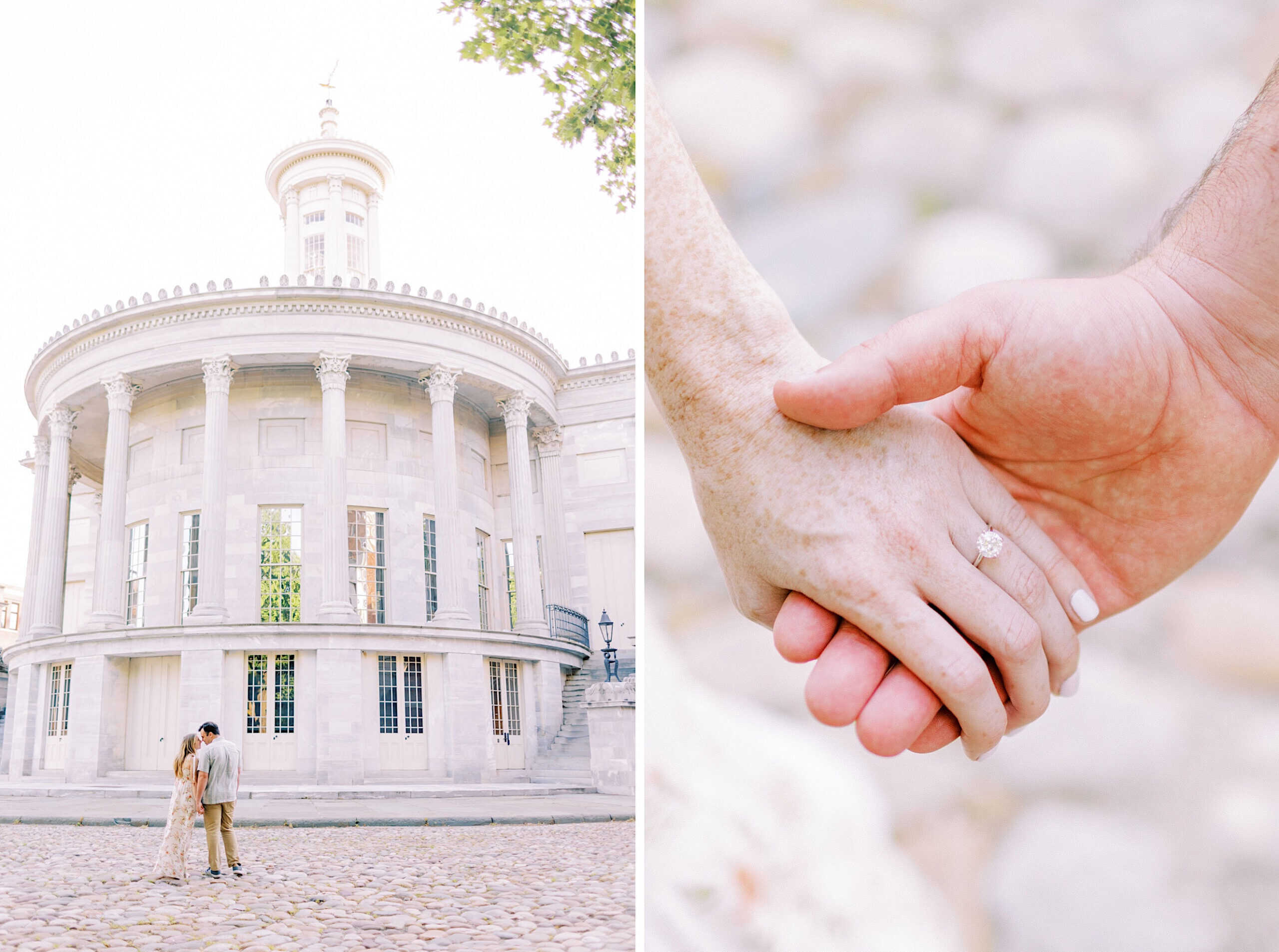 A couple stands in front of a round, columned building in Old City Philadelphia; close-up of their hands shows an engagement ring on the woman's finger.