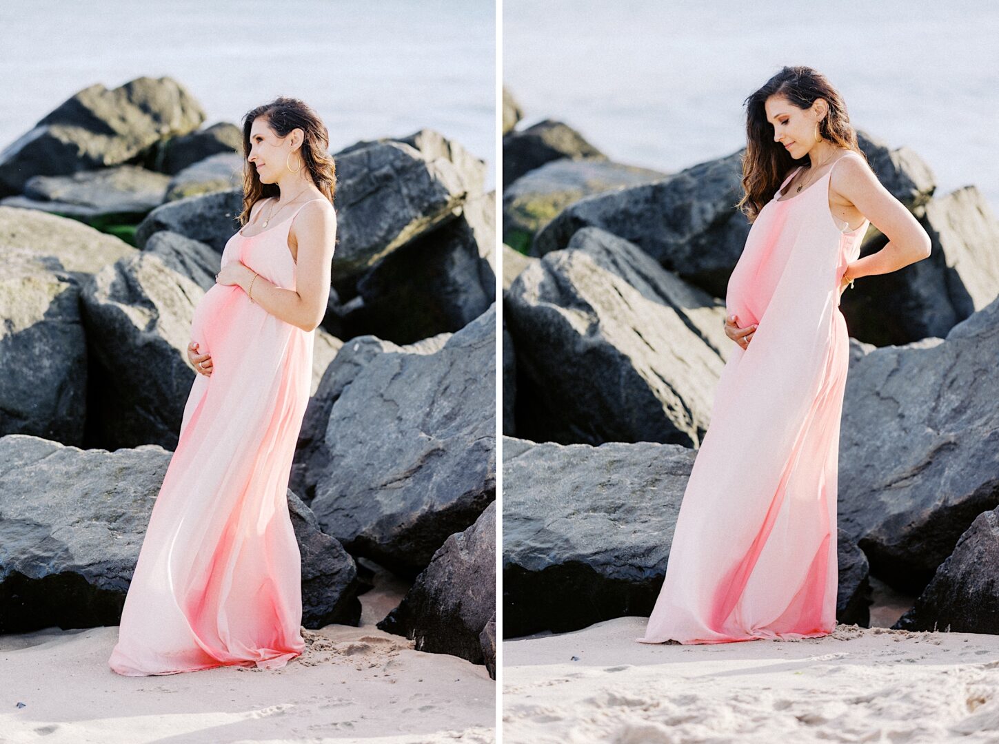 Pregnant woman in a pink flowing dress stands on sandy beach near large rocks, holding her belly and looking down in both images.