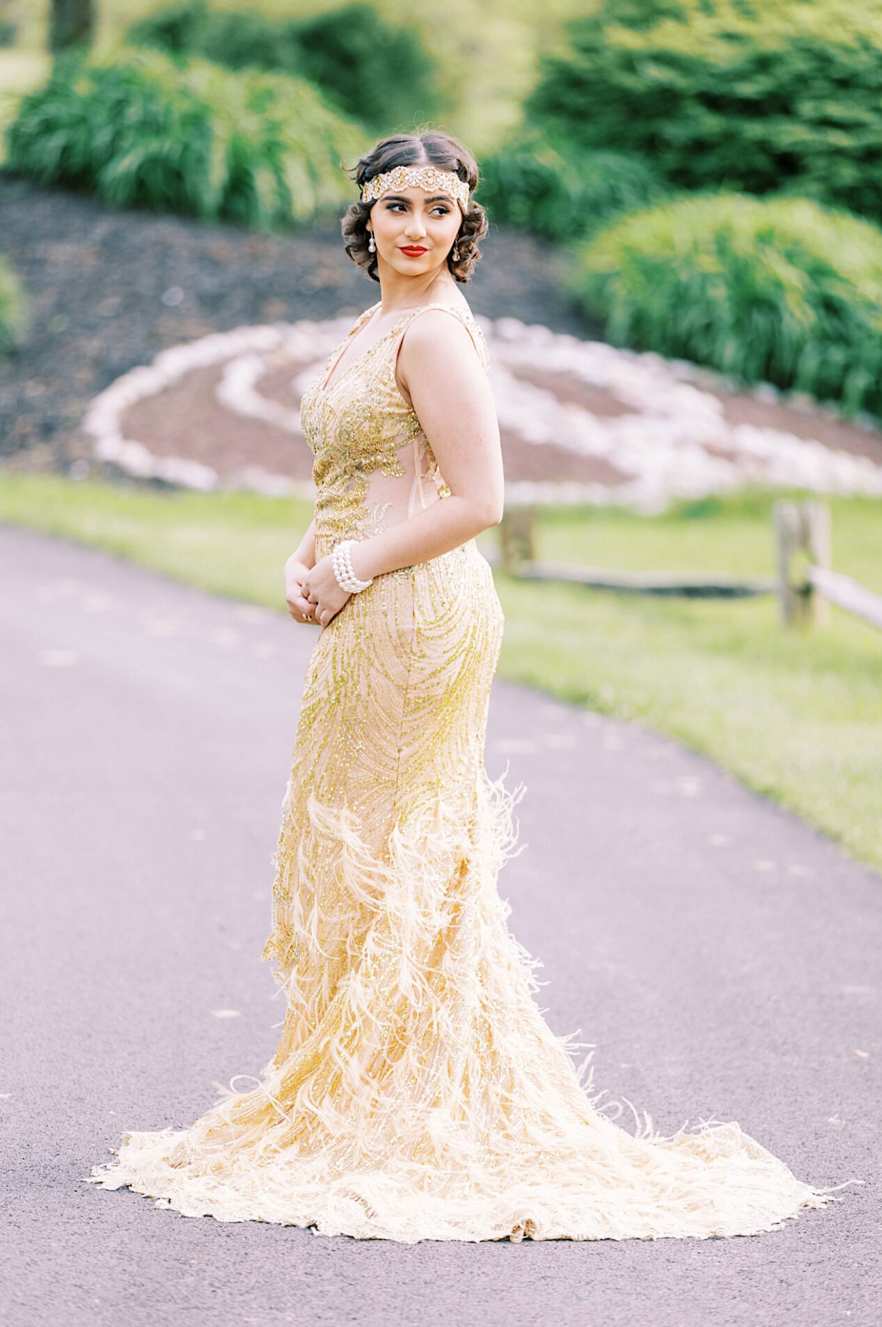 A woman in a gold, embellished gown with a beaded headband poses outdoors; one full-body shot and one close-up of her red lipstick, channeling Great Gatsby Sweet 16 elegance.
