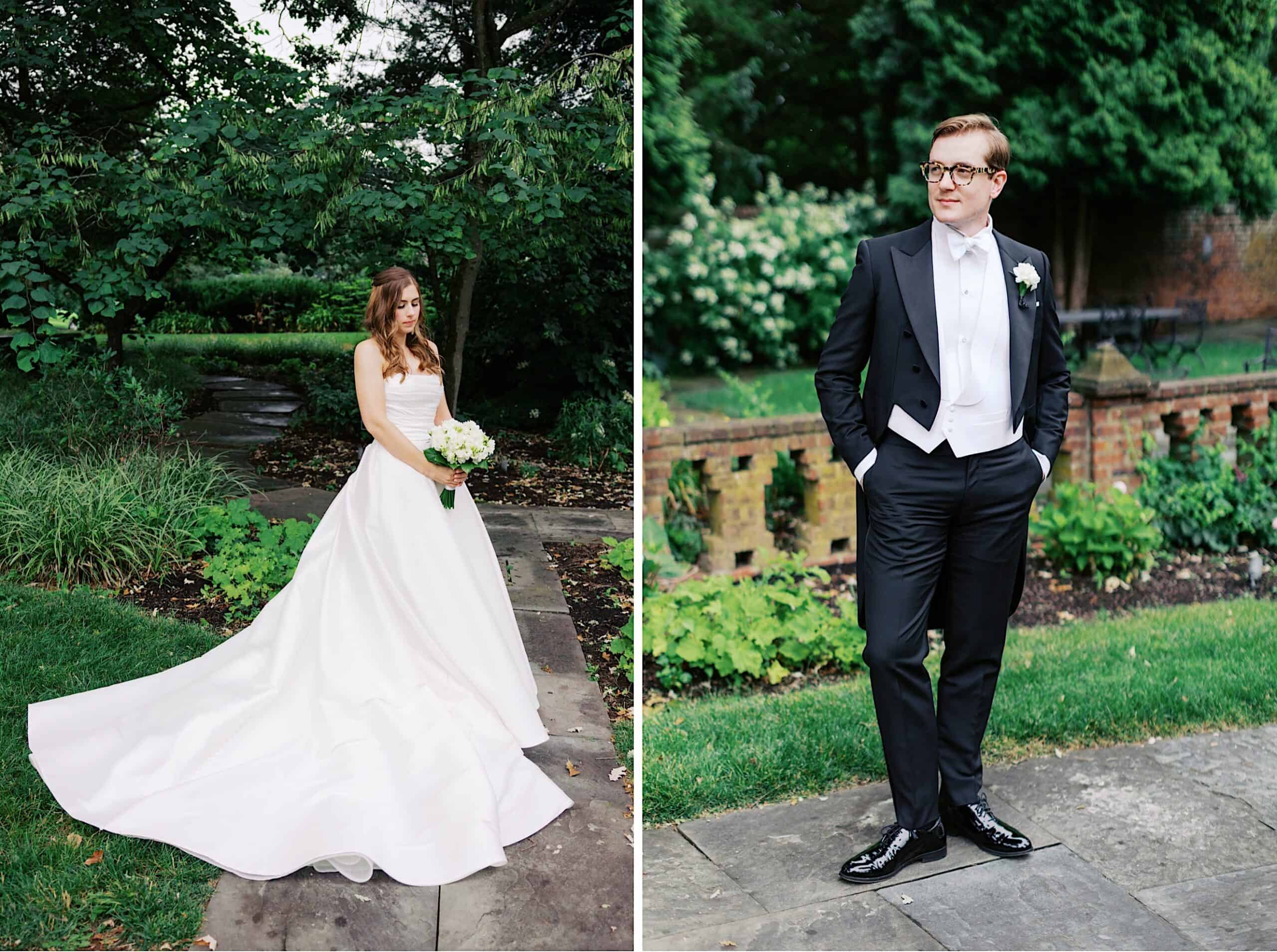 A bride in a white gown stands on a stone path, and a groom in a tuxedo stands with hands in pockets; both are outdoors in the garden during their wedding at Aldie Mansion.