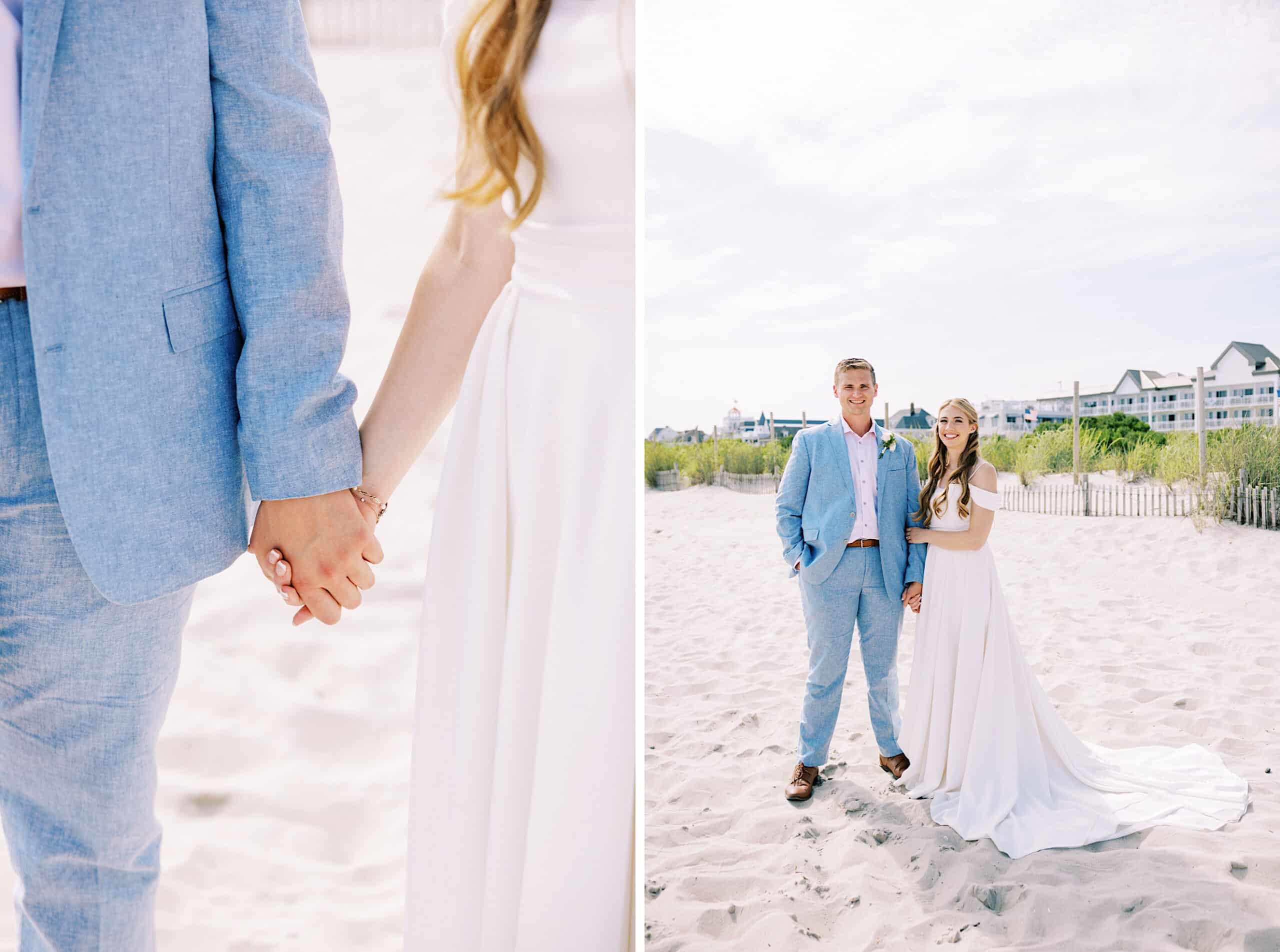 A couple in wedding attire stands and holds hands on the sandy beach at a Montreal Beach Resort wedding, with buildings and a fence visible in the background under a bright sky.