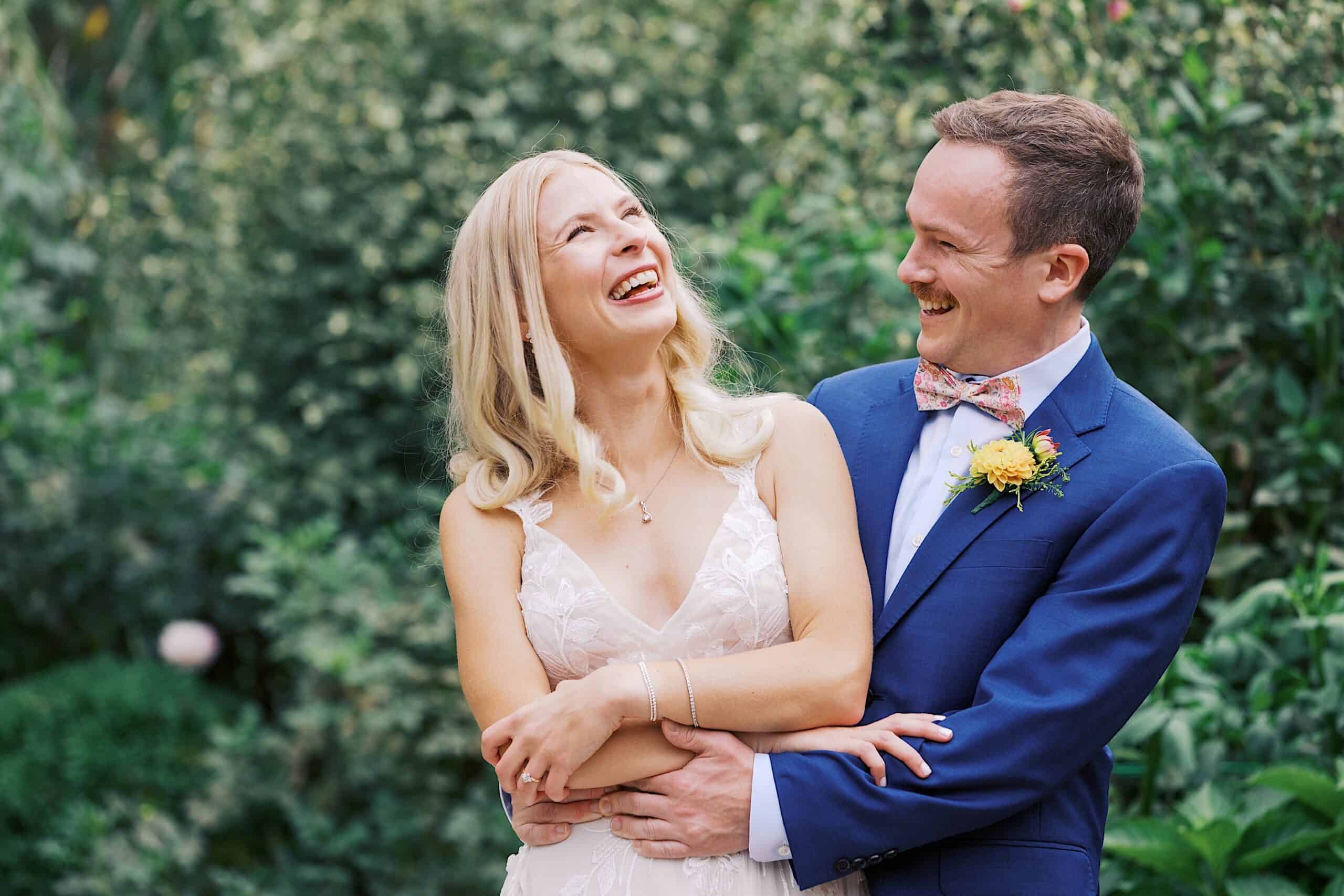 A man and woman smiling at their beautiful wedding at Vincent Forge Mansion.