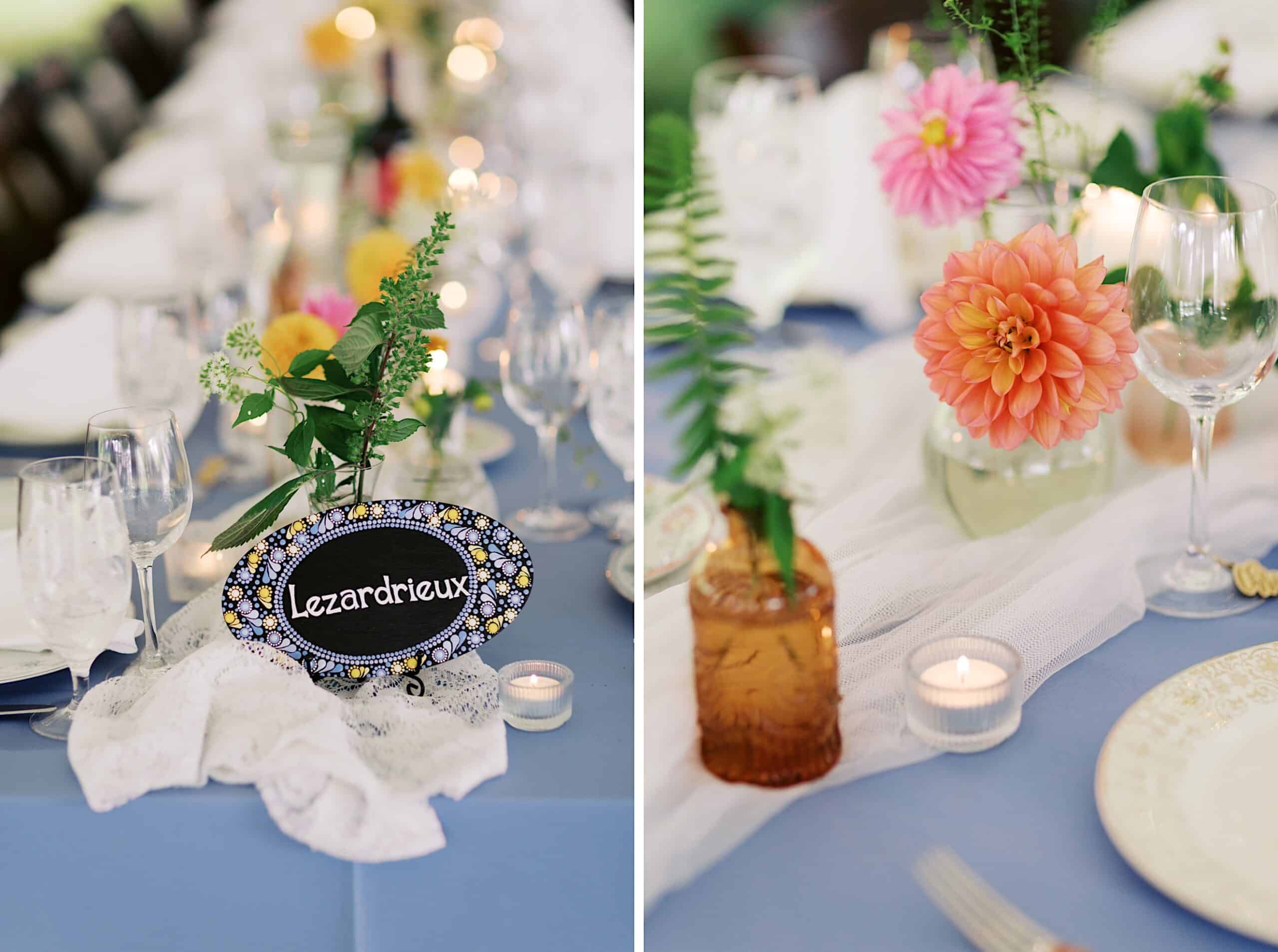 A formal table setting with glassware, flowers in vases, tealight candles, and a decorative sign reading "Lezardrieux" on a blue tablecloth, perfect for a beautiful wedding at Vincent Forge Mansion.