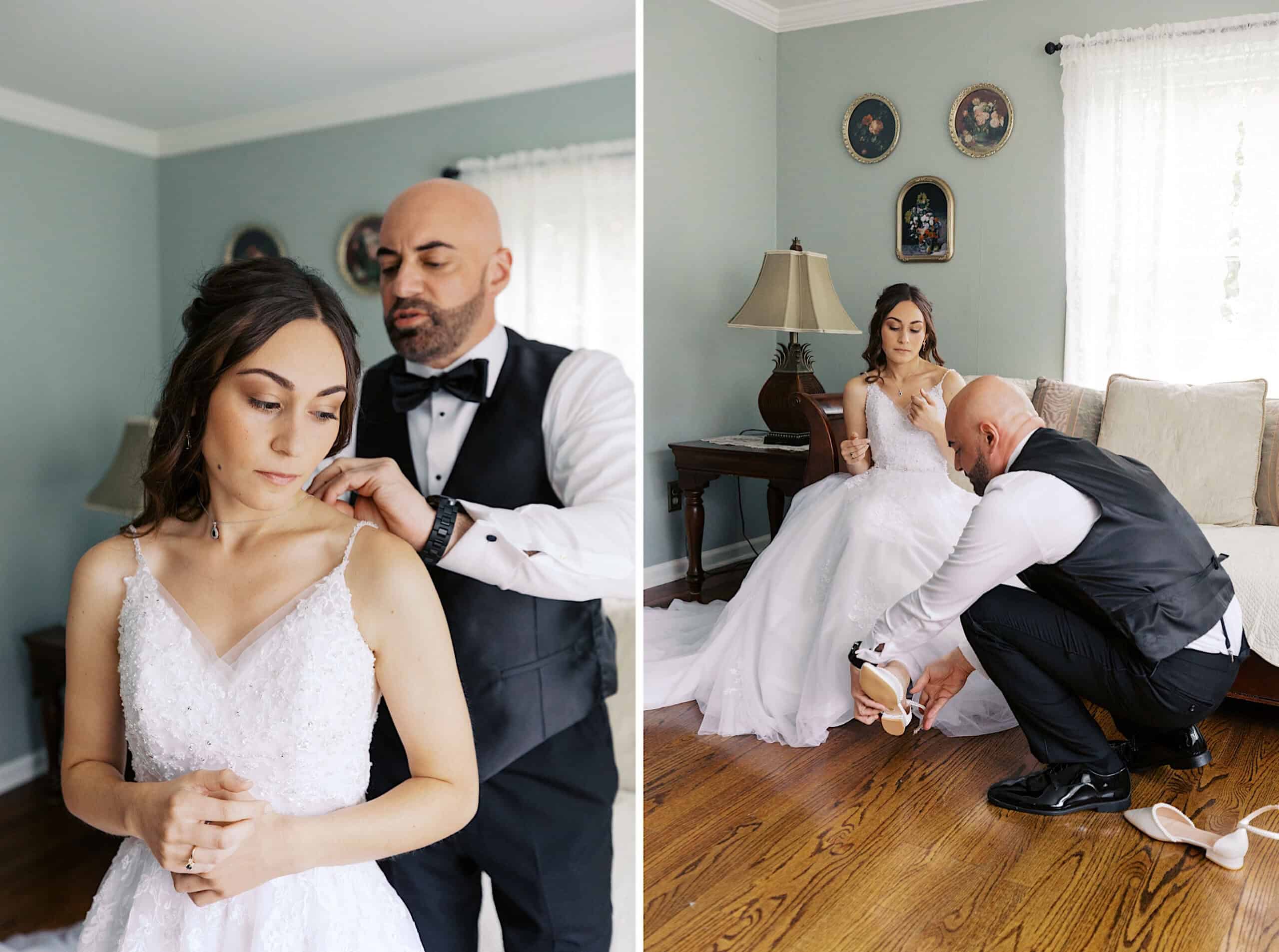 A man helps a bride with her necklace and shoes in a living room at a beautiful Lochwood Manor wedding. The bride, in her white gown, sits on a sofa while the man, dressed in formal attire, assists her.