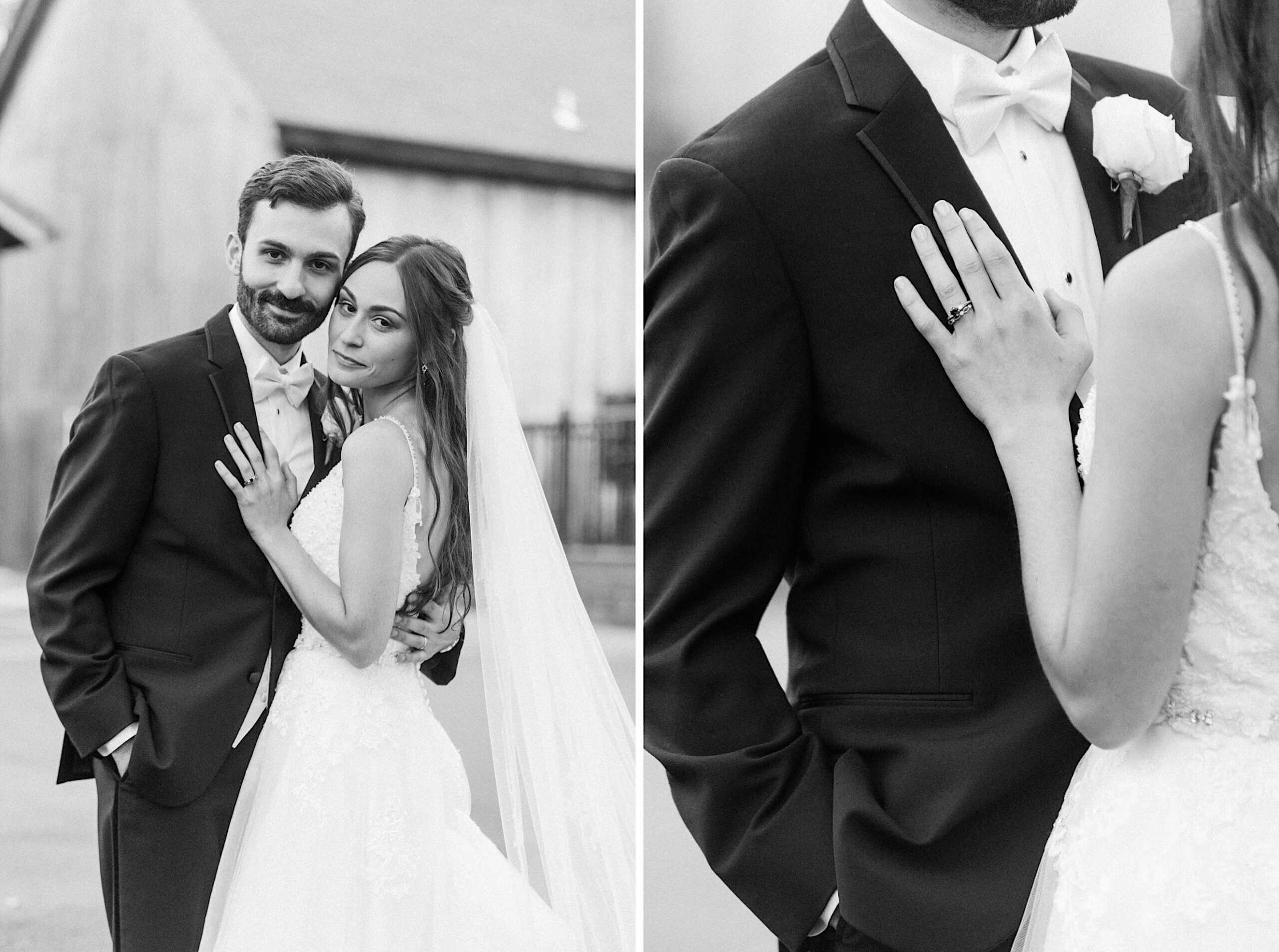 A bride and groom pose together outdoors in formal wedding attire at their beautiful Lochwood Manor wedding; the bride displays her ring on the groom’s chest in a close-up. The image is black and white.