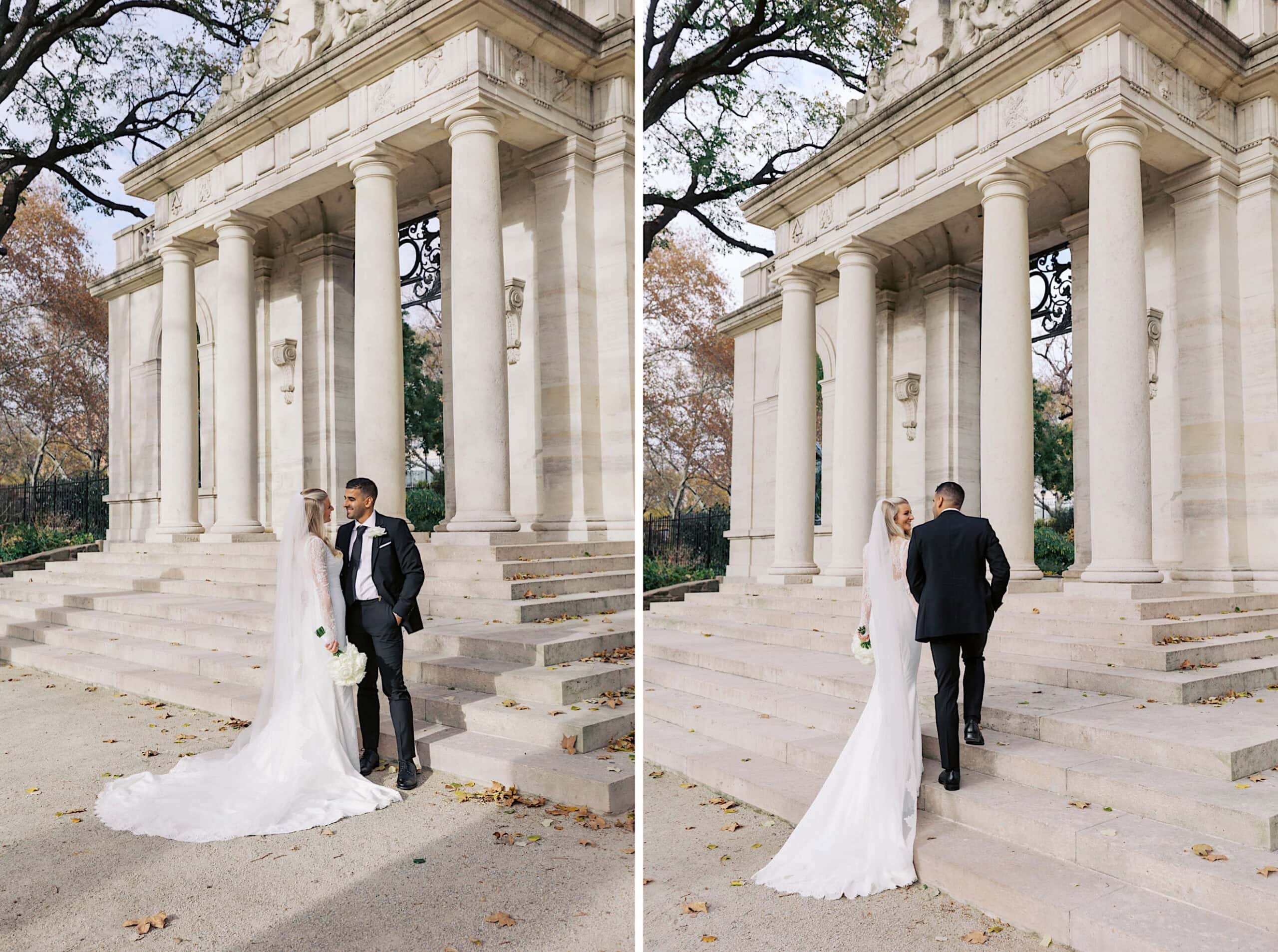 A bride and groom stand and walk together on stone steps outside a classical building with columns, capturing the essence of an elegant Philadelphia Cescaphe Wedding at Tendenza.