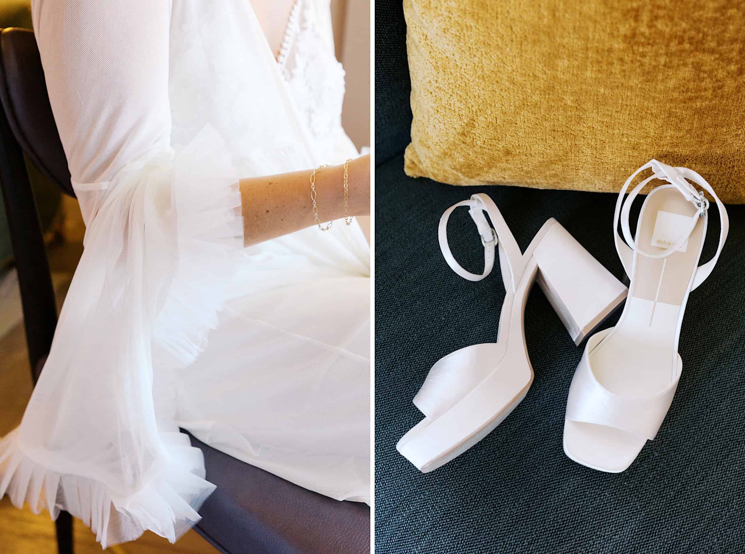 A person in a white, sheer, ruffled-sleeve dress sits on a chair; beside them, white high-heeled sandals rest on a dark cushion with a gold pillow—capturing the elegance of a Classic Wedding at Ballroom at the Ben.