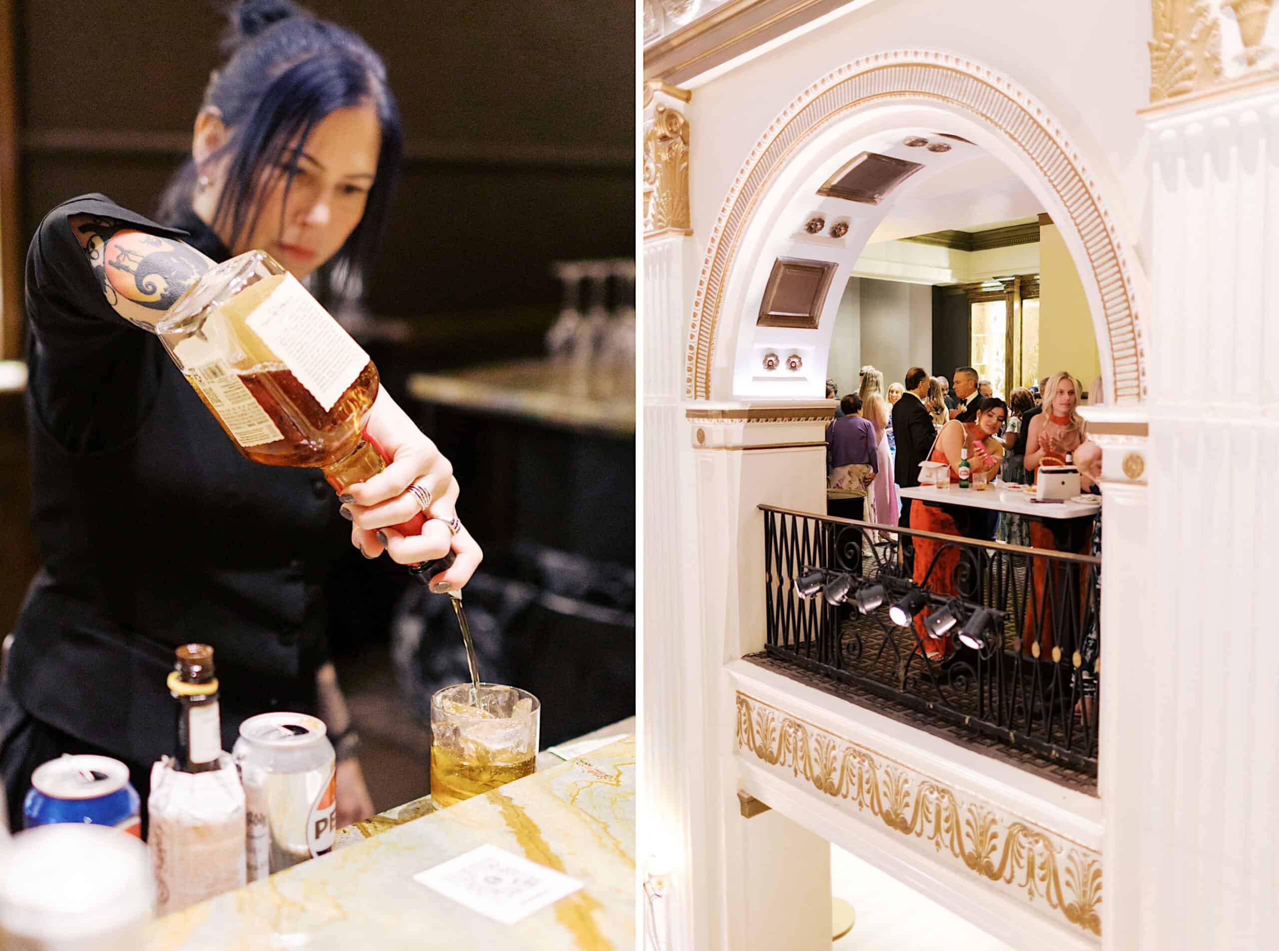 A bartender pours a drink at a bar as guests socialize on a balcony in the grand, ornate Ballroom at the Ben during a classic wedding.