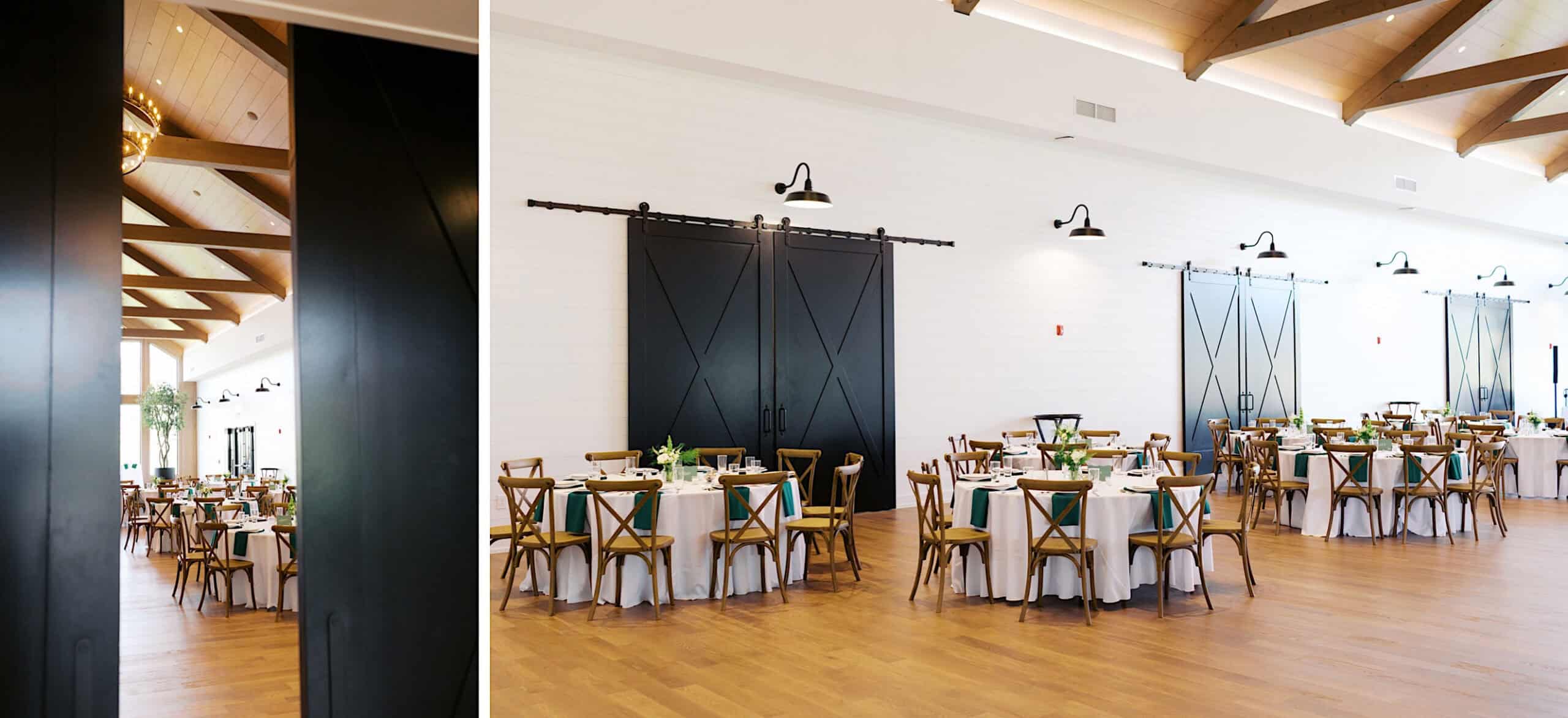 A spacious event hall at Westwynd Gardens, perfect for a Spring Wedding, features wooden floors, round tables with white linens and green napkins, wooden chairs, and large black sliding barn doors on a white wall.