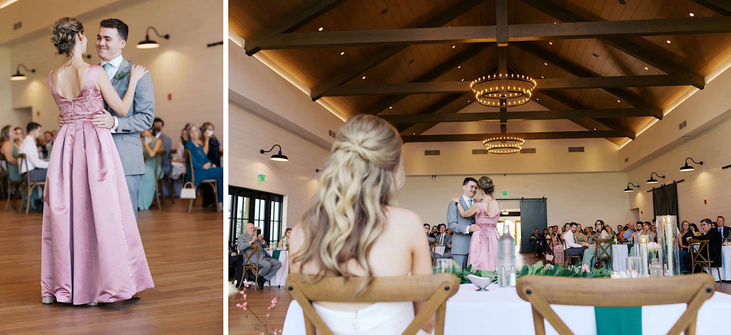 A young couple dances in the center of the expansive, wood-beamed hall at their Westwynd Gardens Spring Wedding, while guests watch from their tables.