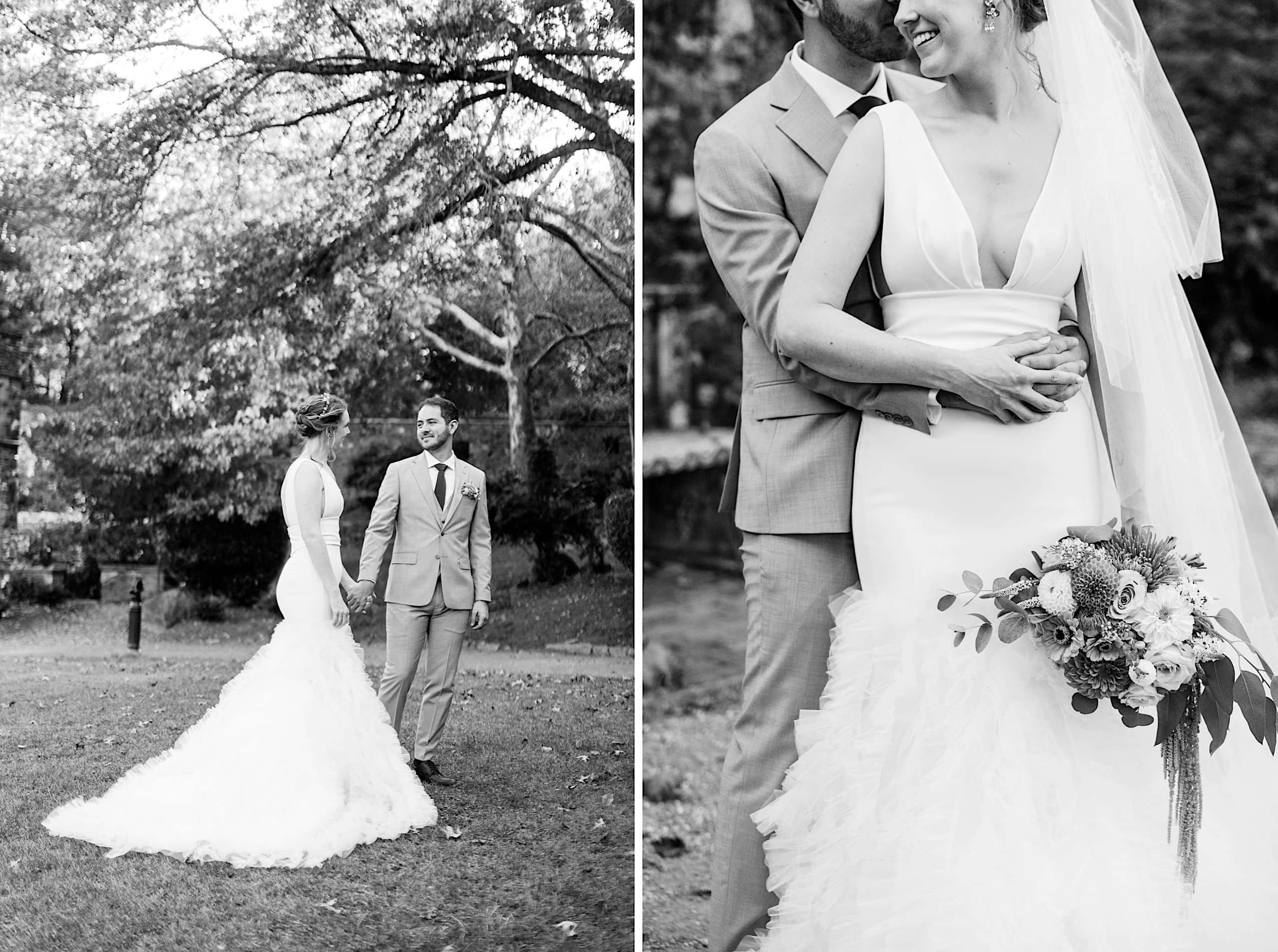 A bride and groom stand together outdoors at their Parque Ridley Creek garden ceremony, holding hands and embracing, dressed in wedding attire. The scene is calm and romantic.