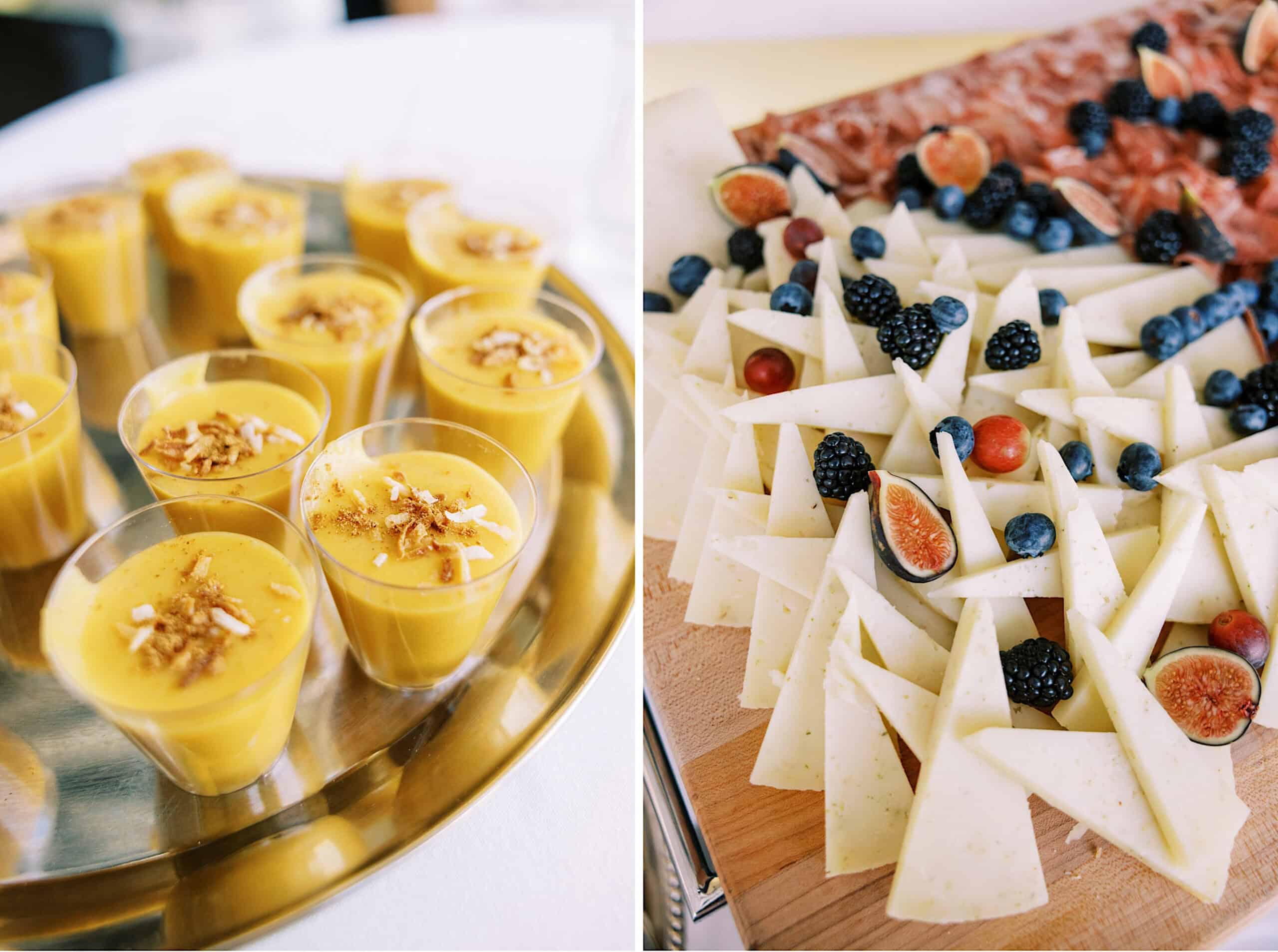 At a romantic November wedding at Congress Hall, a tray of small cups filled with yellow dessert topped with nuts sits beside a platter of sliced cheese garnished with berries and figs.